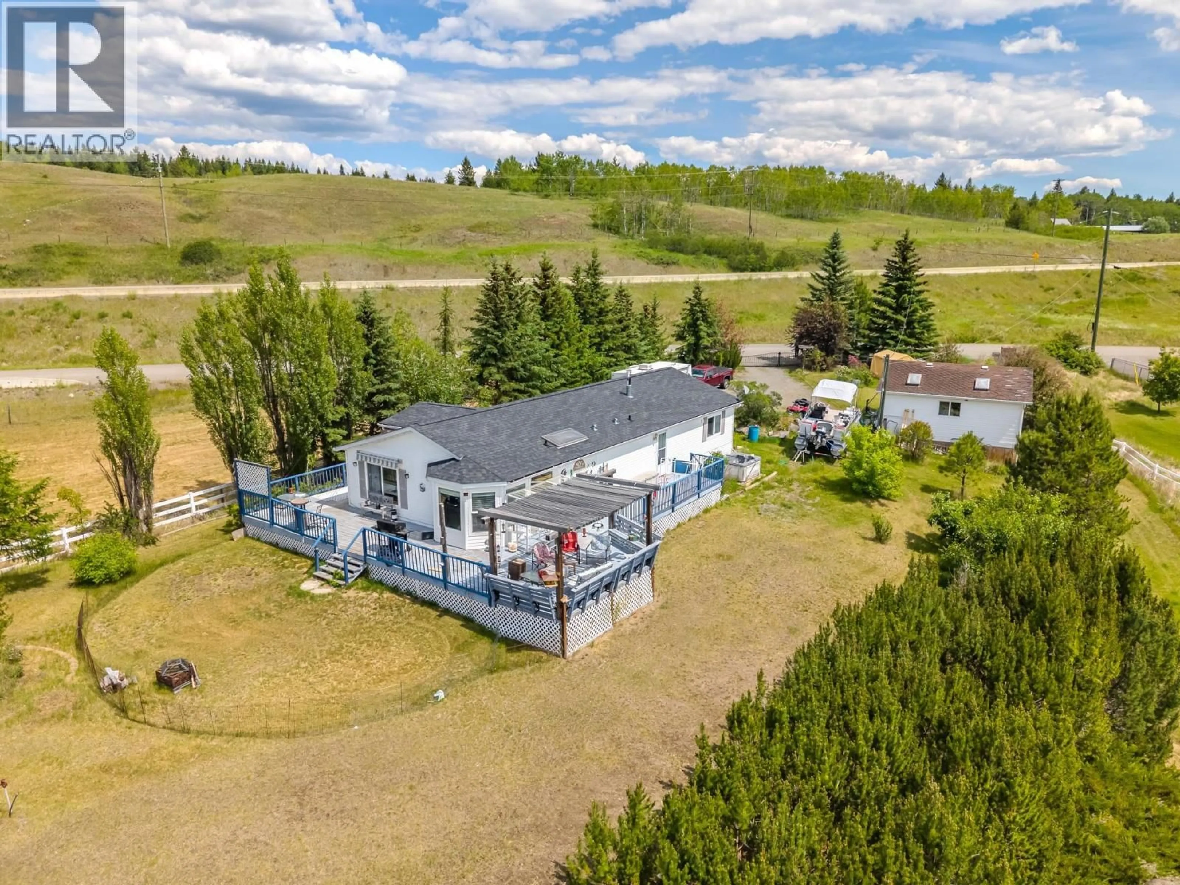 A pic from outside/outdoor area/front of a property/back of a property/a pic from drone, unknown for 3442 DUNSMUIR ROAD, Lac La Hache British Columbia V0K1T1