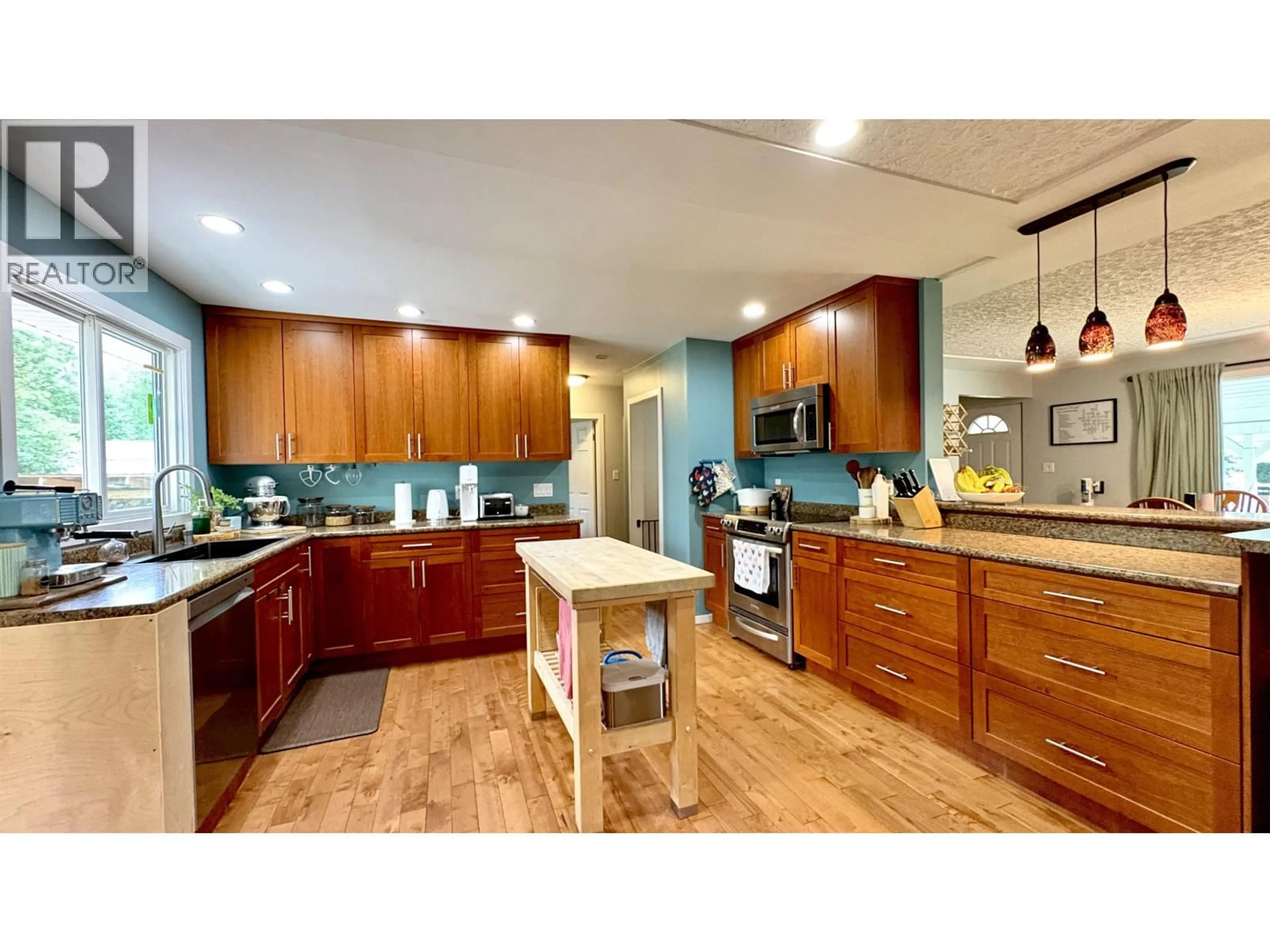 Open concept kitchen, wood/laminate floor for 4535 MYERS ROAD, Hixon British Columbia V2N5Z7