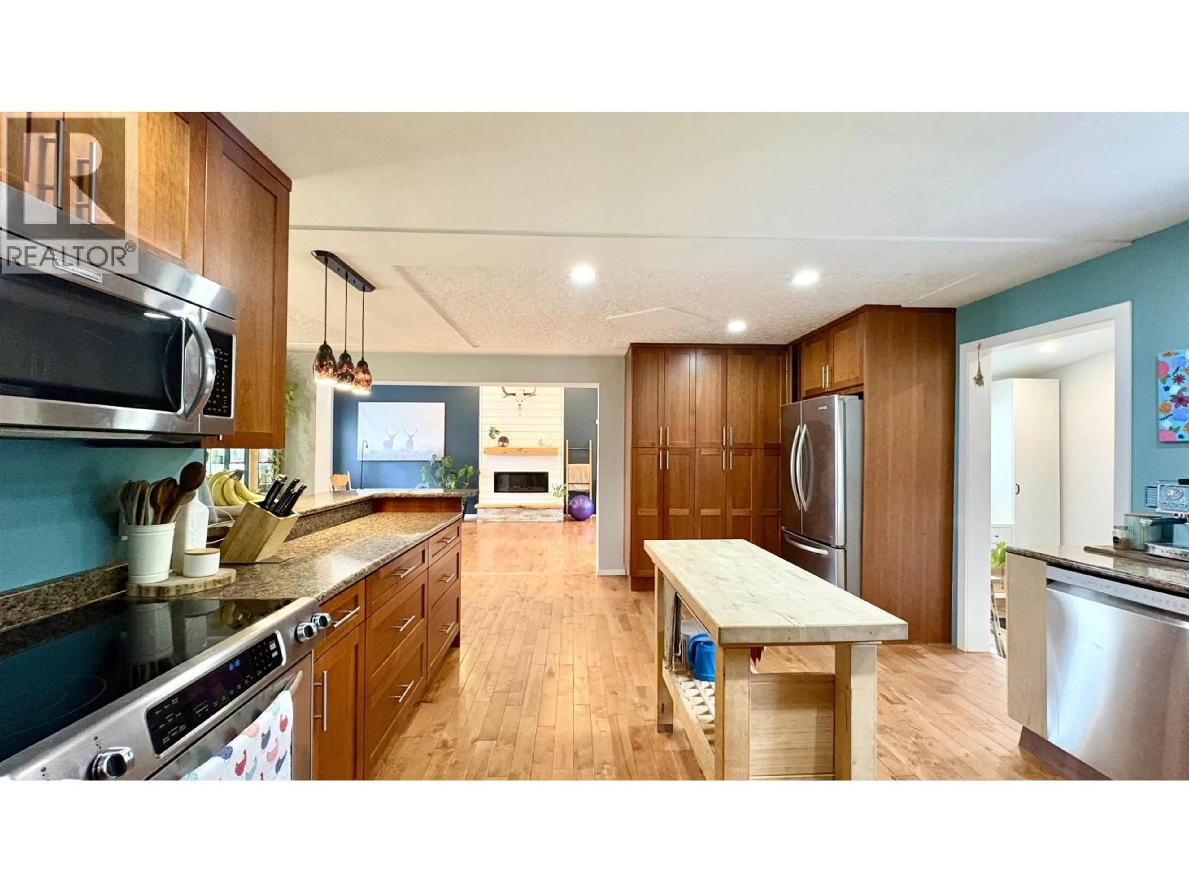 Open concept kitchen, wood/laminate floor for 4535 MYERS ROAD, Hixon British Columbia V2N5Z7