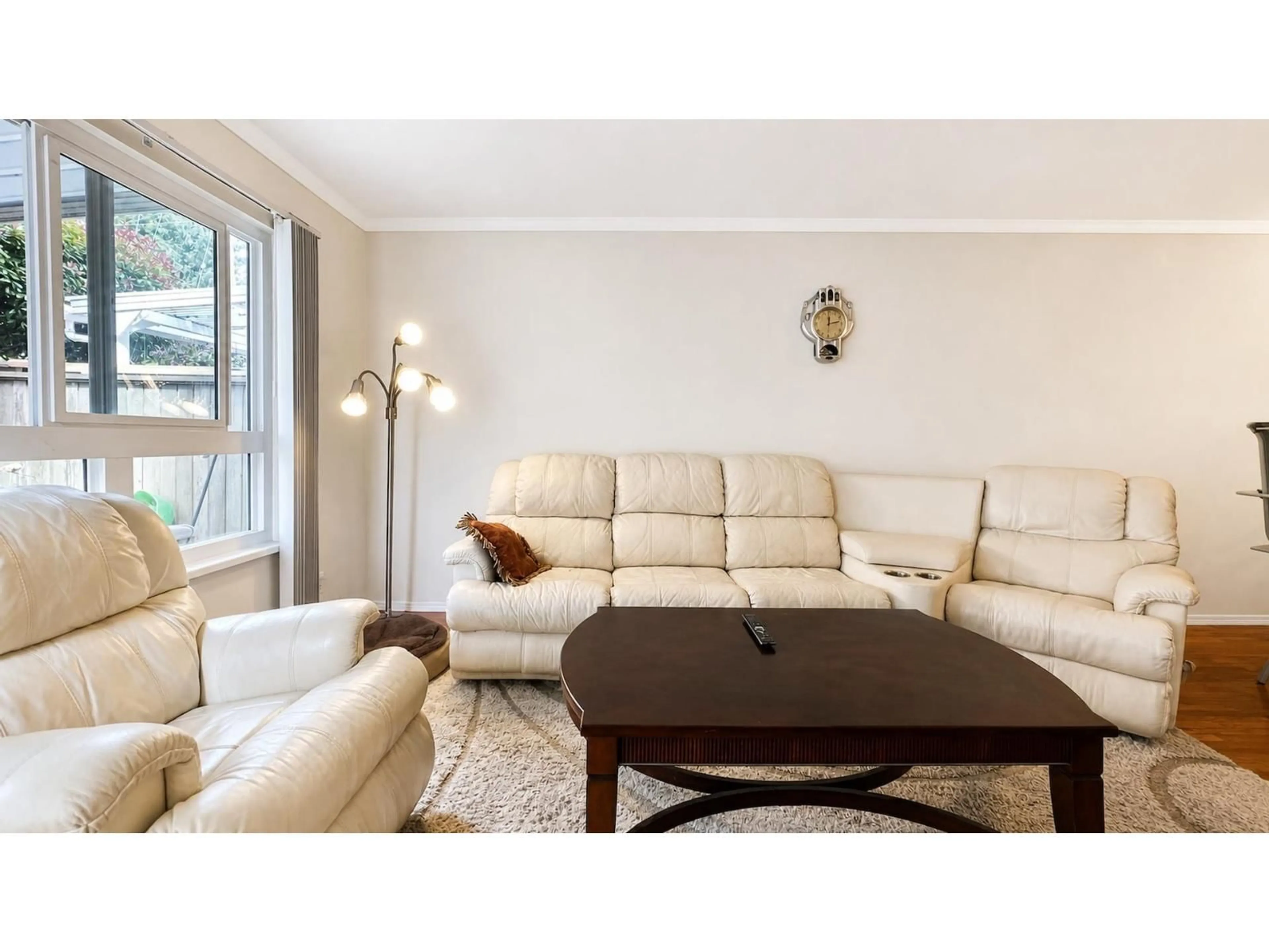 Living room with furniture, wood/laminate floor for 105 - 12233 92 AVENUE, Surrey British Columbia V3V7R8
