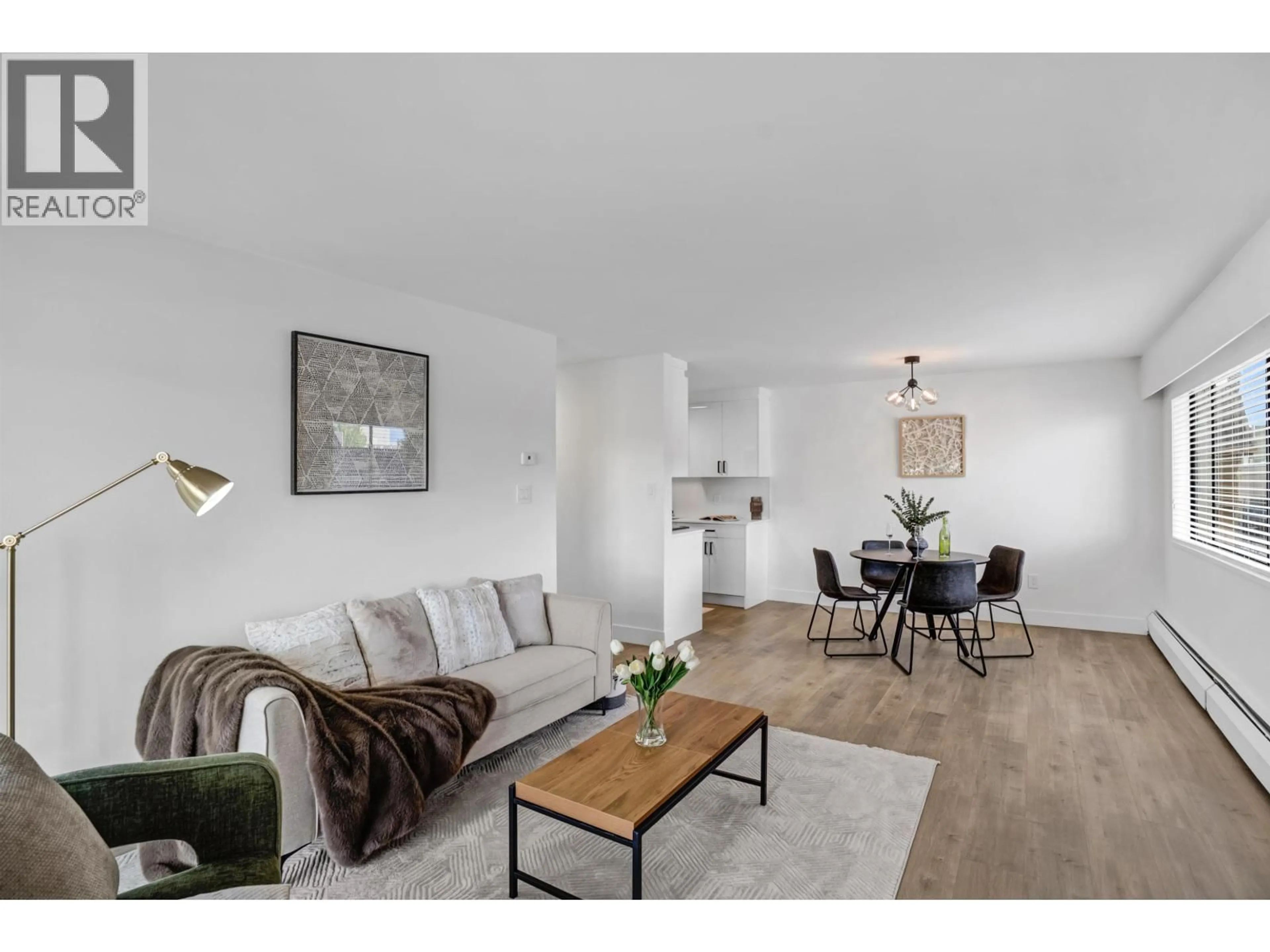 Living room with furniture, wood/laminate floor for 206 - 2299 30TH AVENUE, Vancouver British Columbia V5N5N1