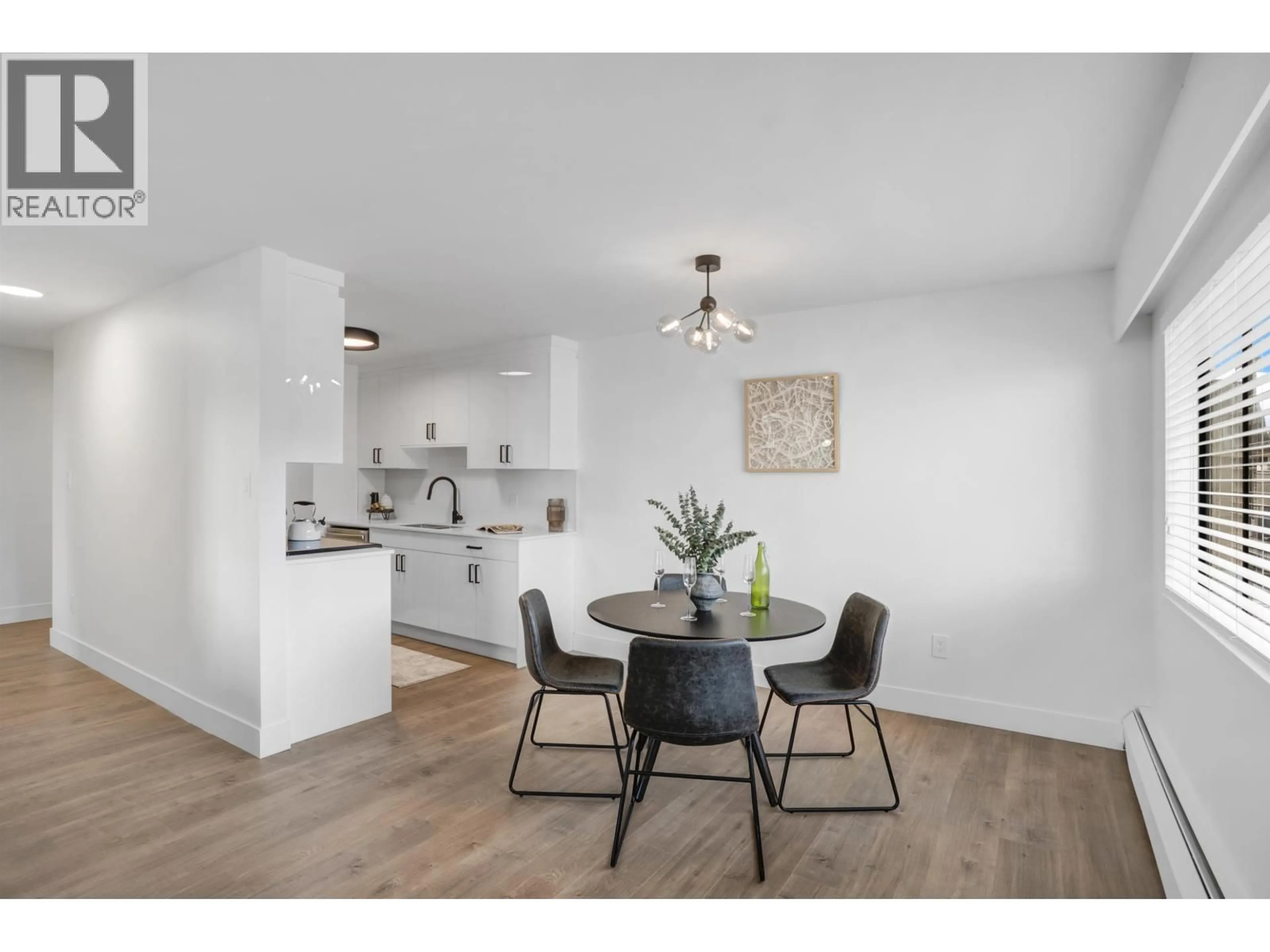 Open concept kitchen, wood/laminate floor for 206 - 2299 30TH AVENUE, Vancouver British Columbia V5N5N1