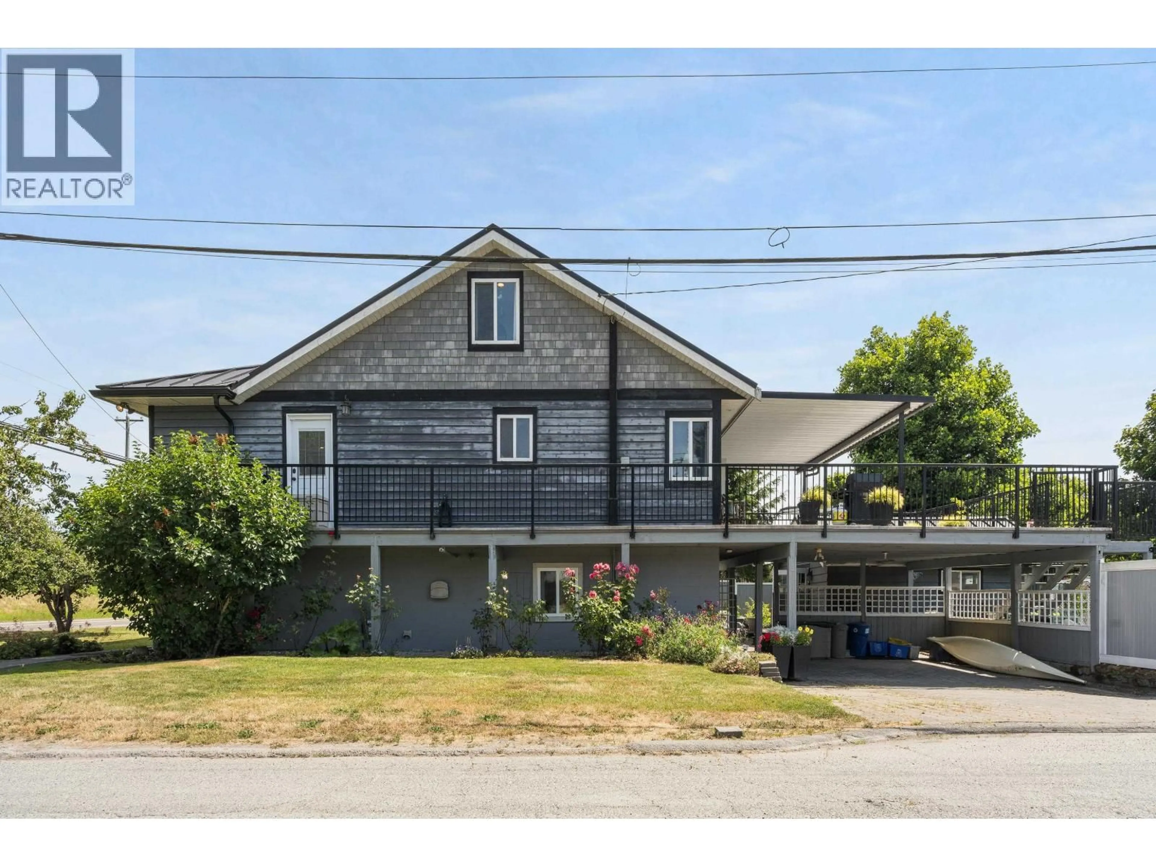 A pic from outside/outdoor area/front of a property/back of a property/a pic from drone, street for 4504 RIVER ROAD ROAD, Delta British Columbia V4K1S4