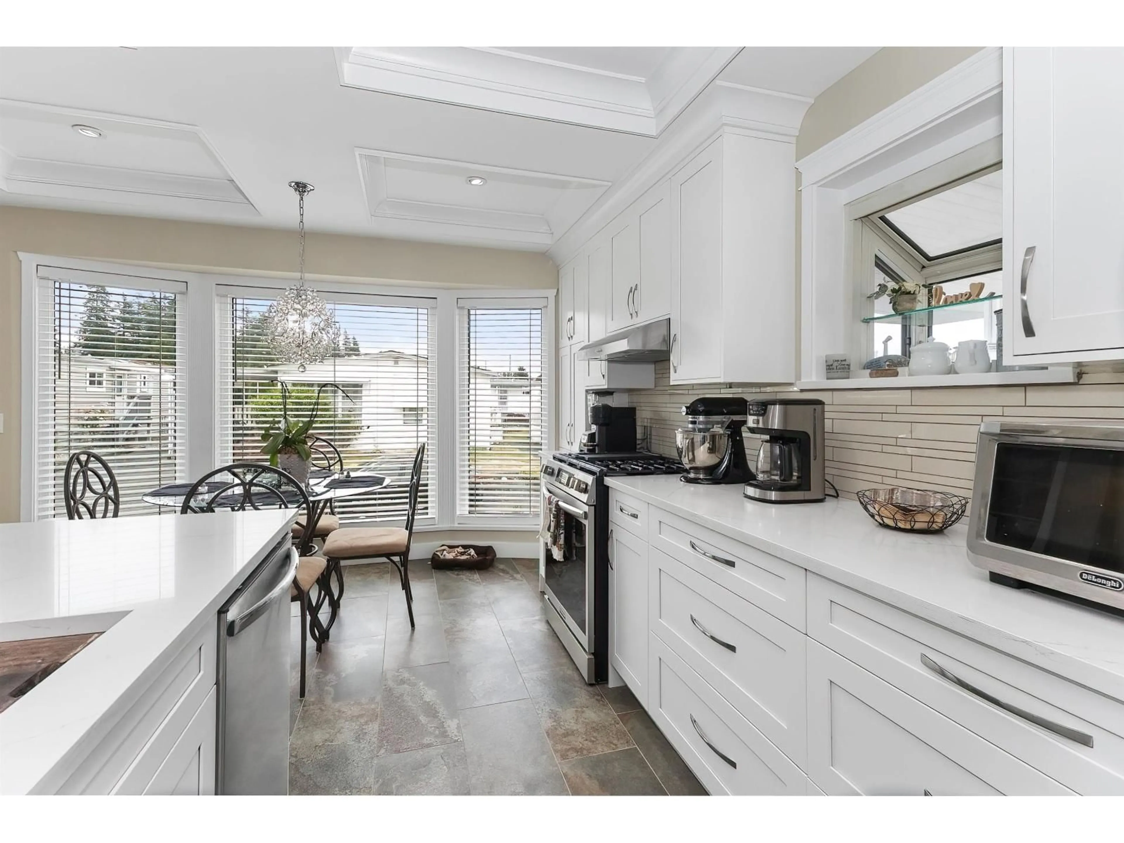 Open concept kitchen, ceramic/tile floor for 103 - 27111 0 AVENUE, Langley British Columbia V4W2T2