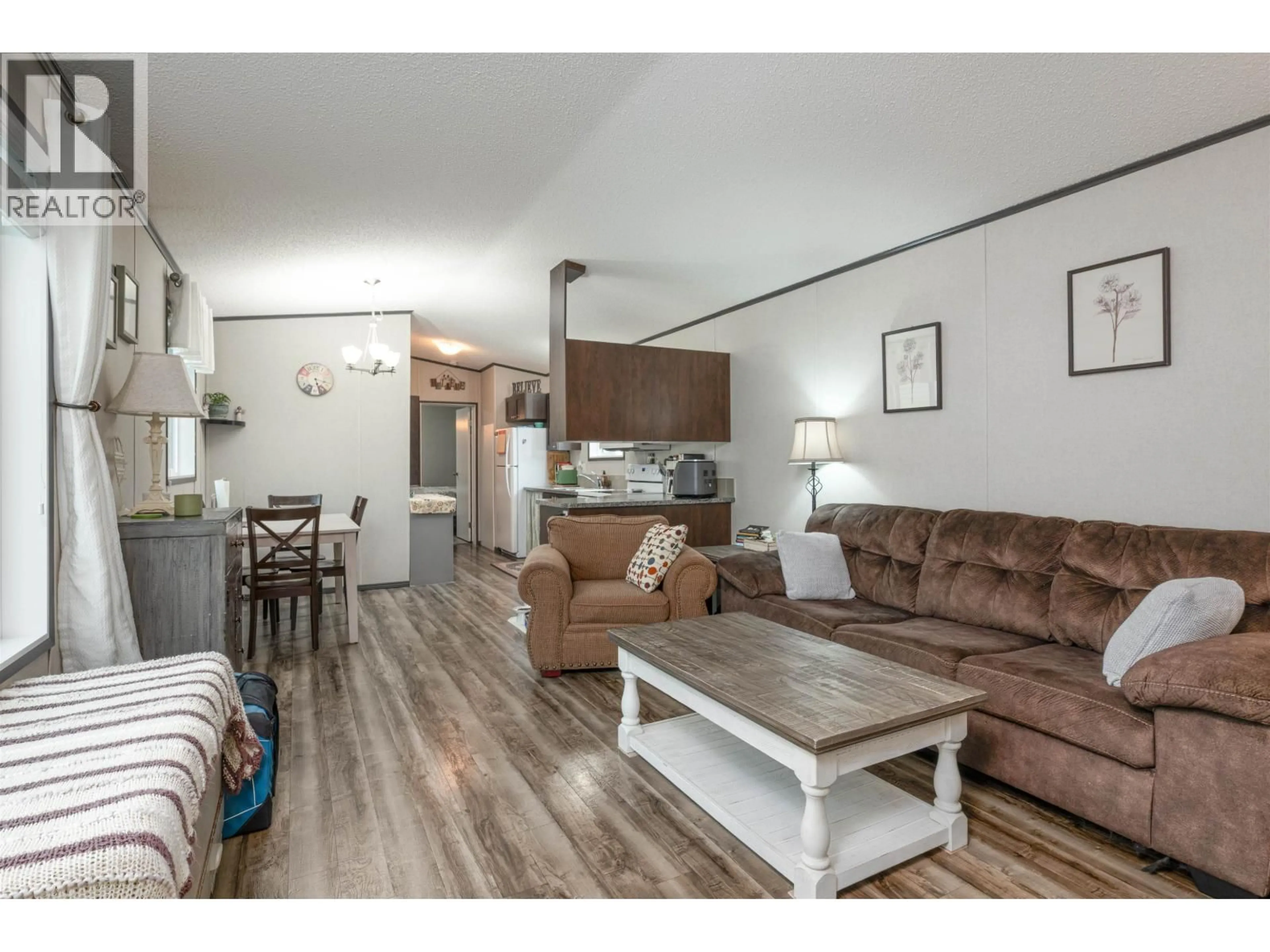 Living room with furniture, wood/laminate floor for 13 - 8474 BUNCE ROAD, Prince George British Columbia V2N6P1