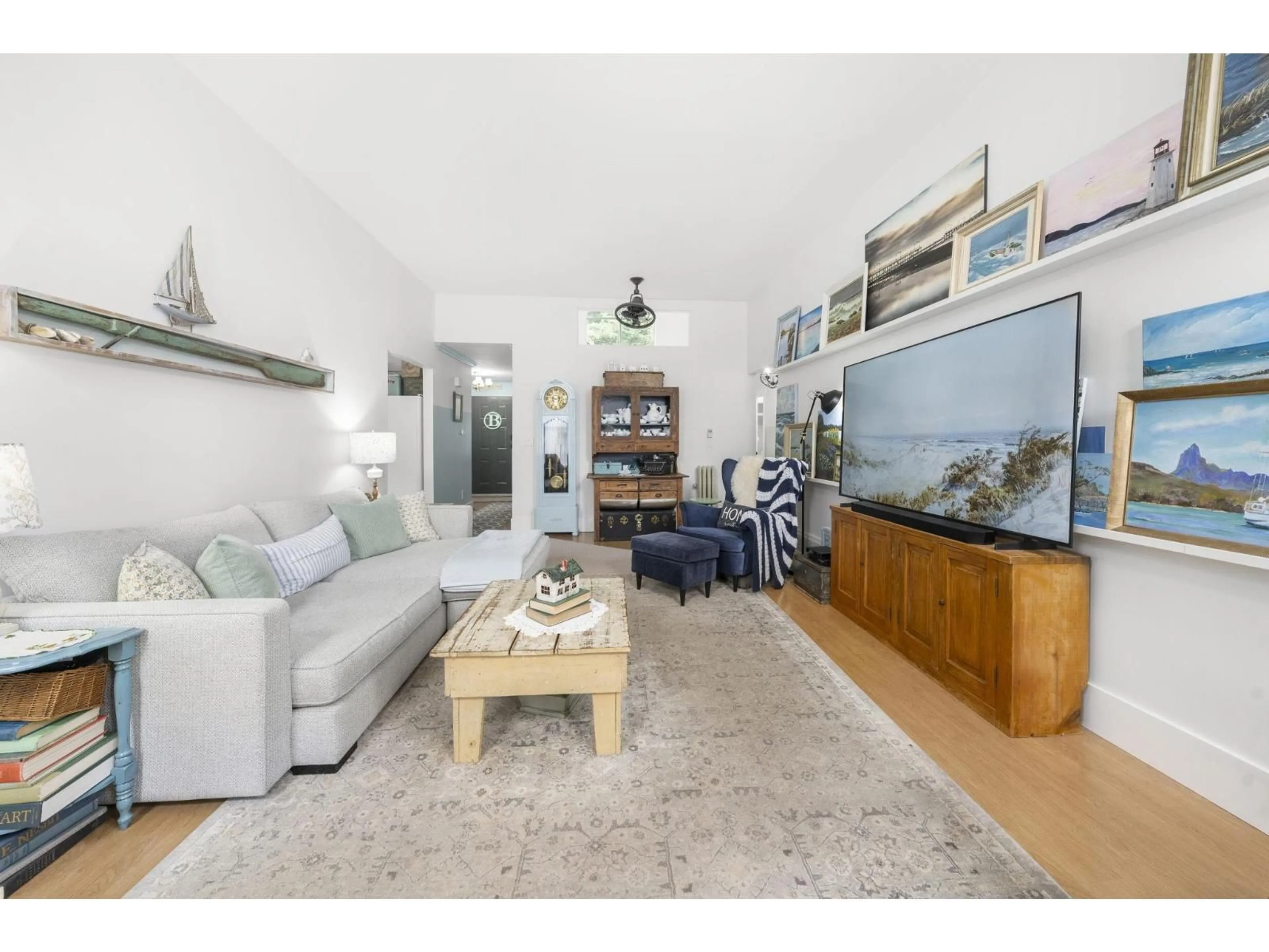 Living room with furniture, wood/laminate floor for 116 - 1744 128 STREET, Surrey British Columbia V4A3V4