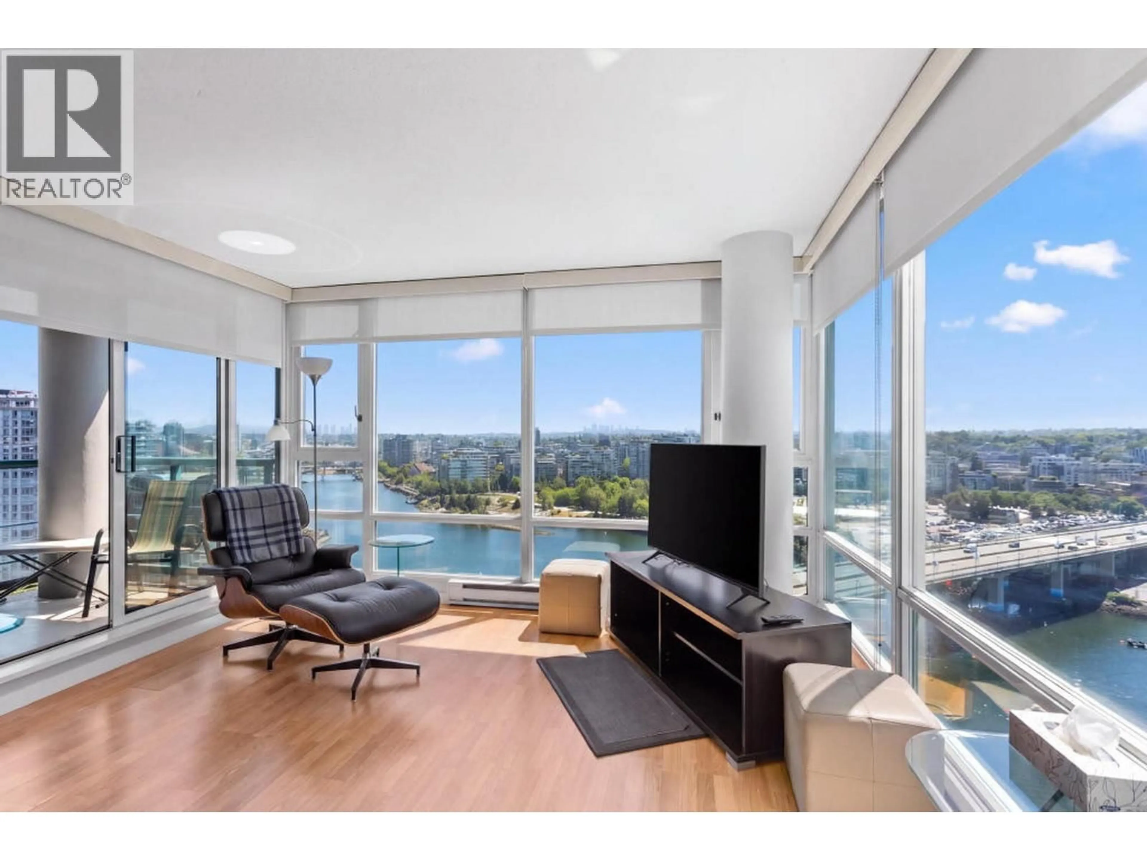 Living room with furniture, wood/laminate floor for 2505 - 1033 MARINASIDE CRESCENT, Vancouver British Columbia V6Z3A3