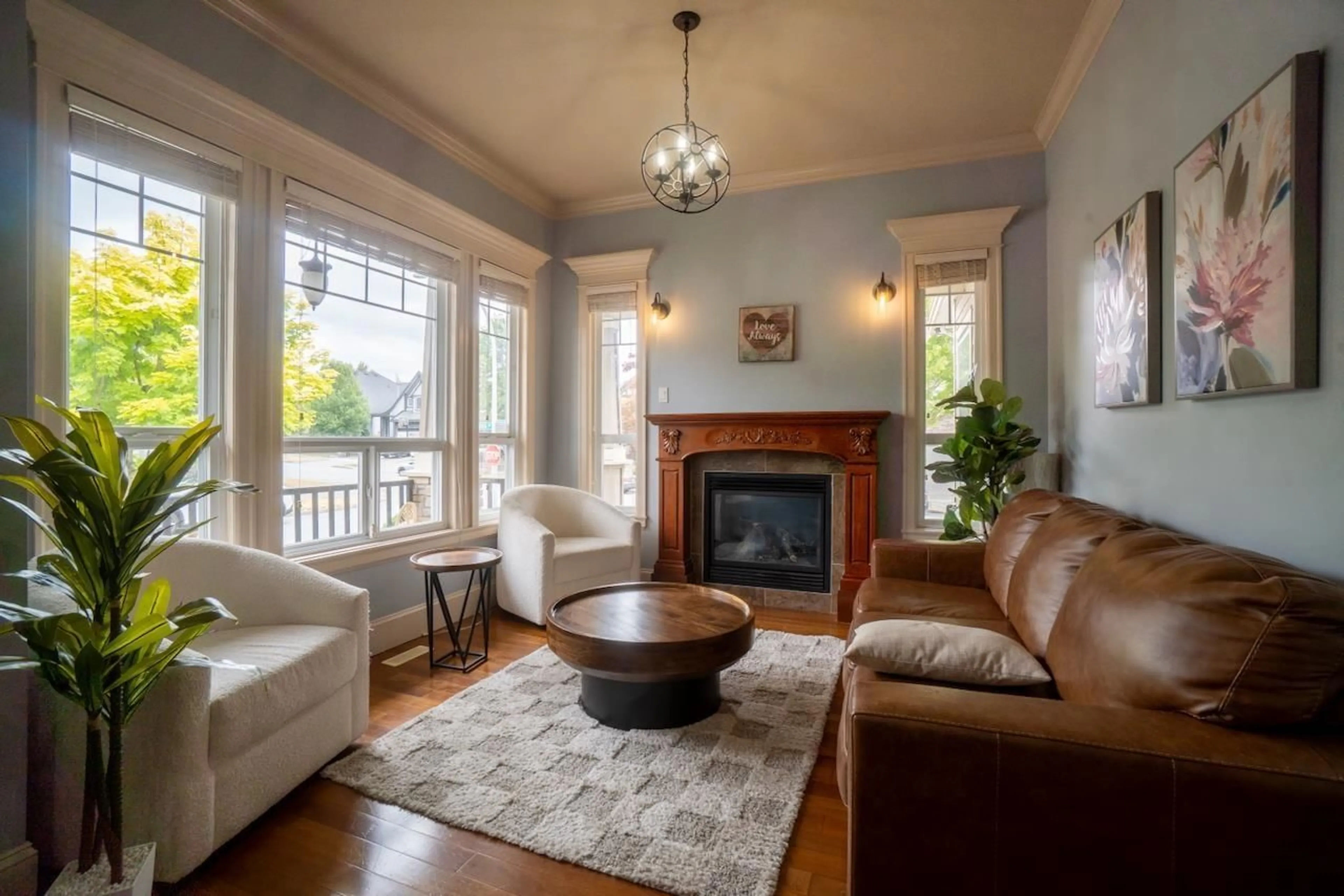 Living room with furniture, wood/laminate floor for 18938 54A AVENUE, Surrey British Columbia V3S6R4