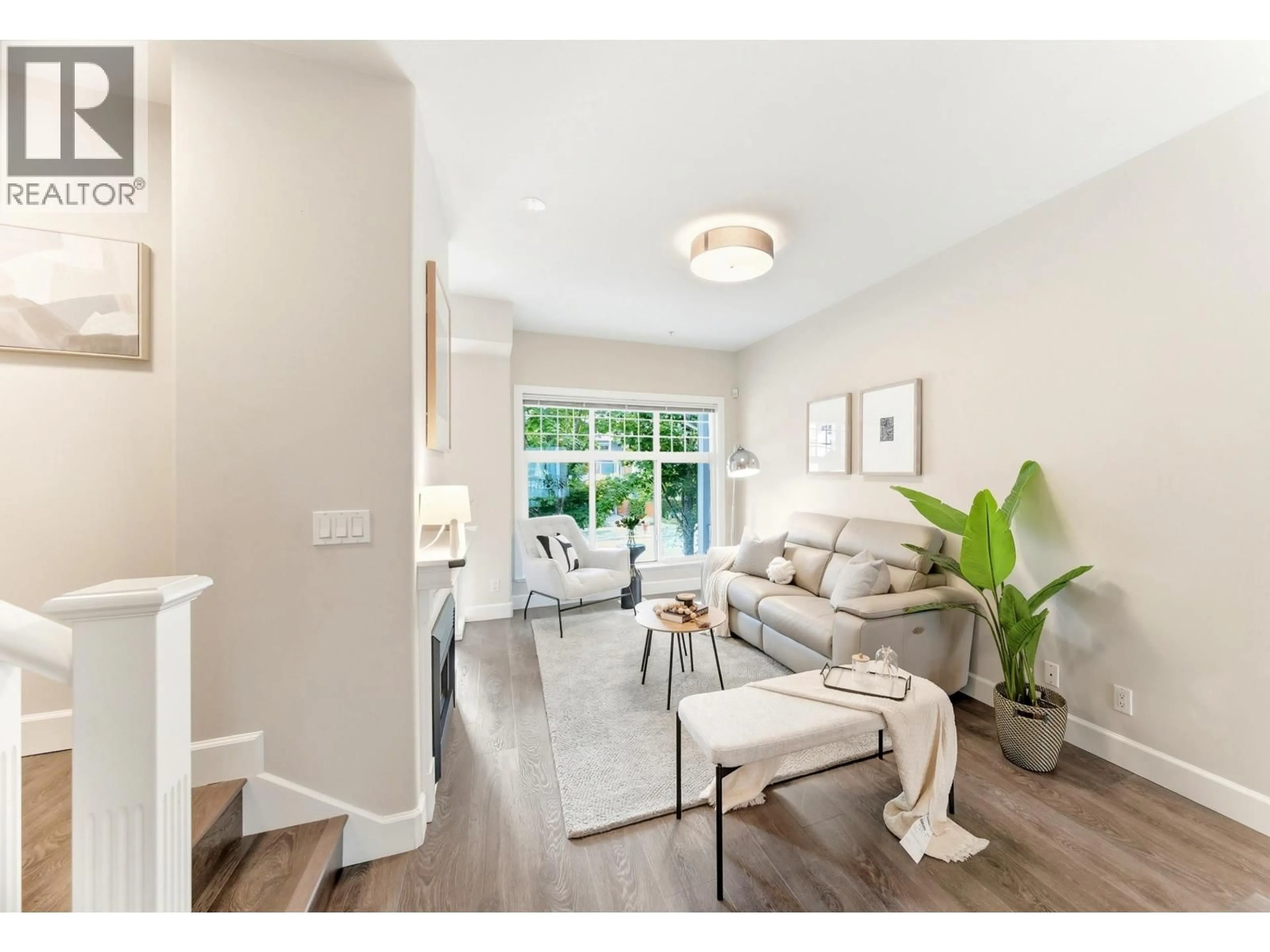 Living room with furniture, wood/laminate floor for 22 - 12333 ENGLISH AVENUE, Richmond British Columbia V7E6T2