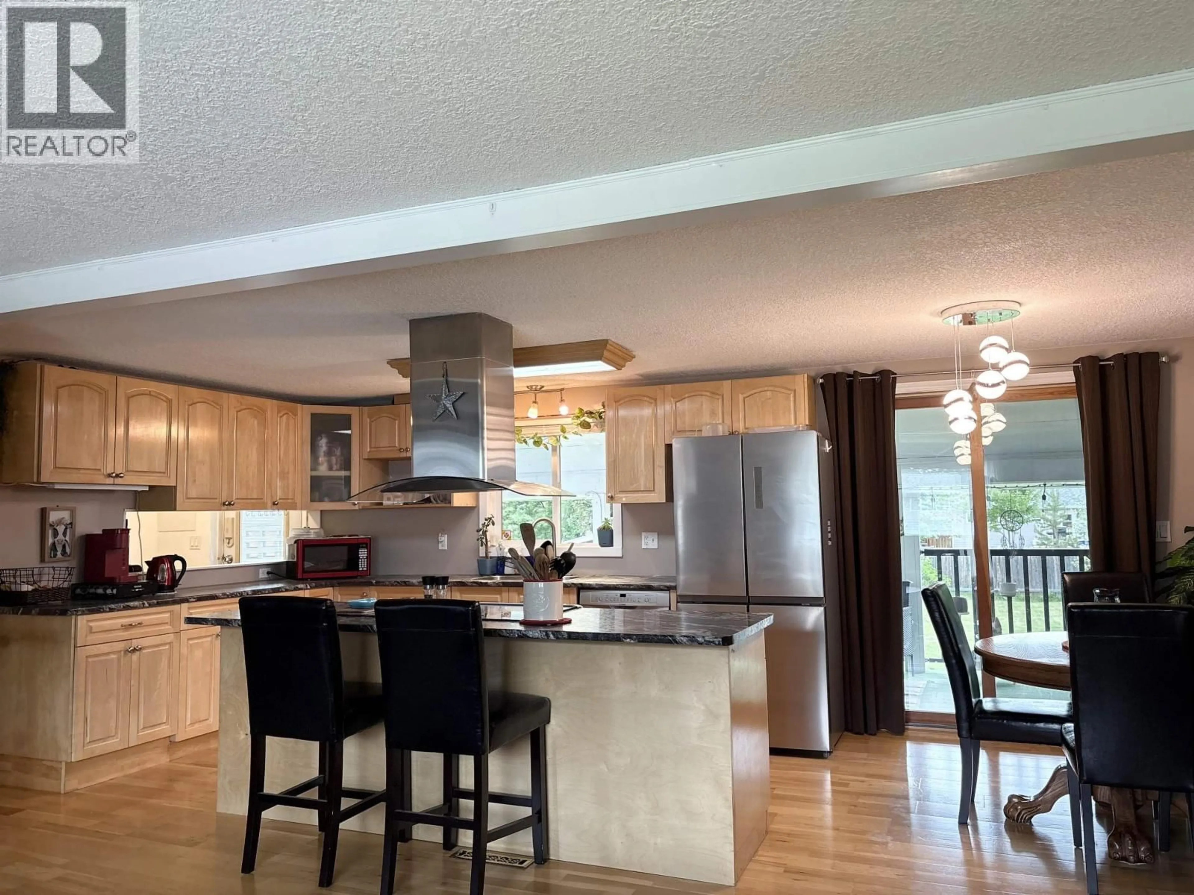Open concept kitchen, wood/laminate floor for 4114 CHURCHILL ROAD, Prince George British Columbia V2K1C3