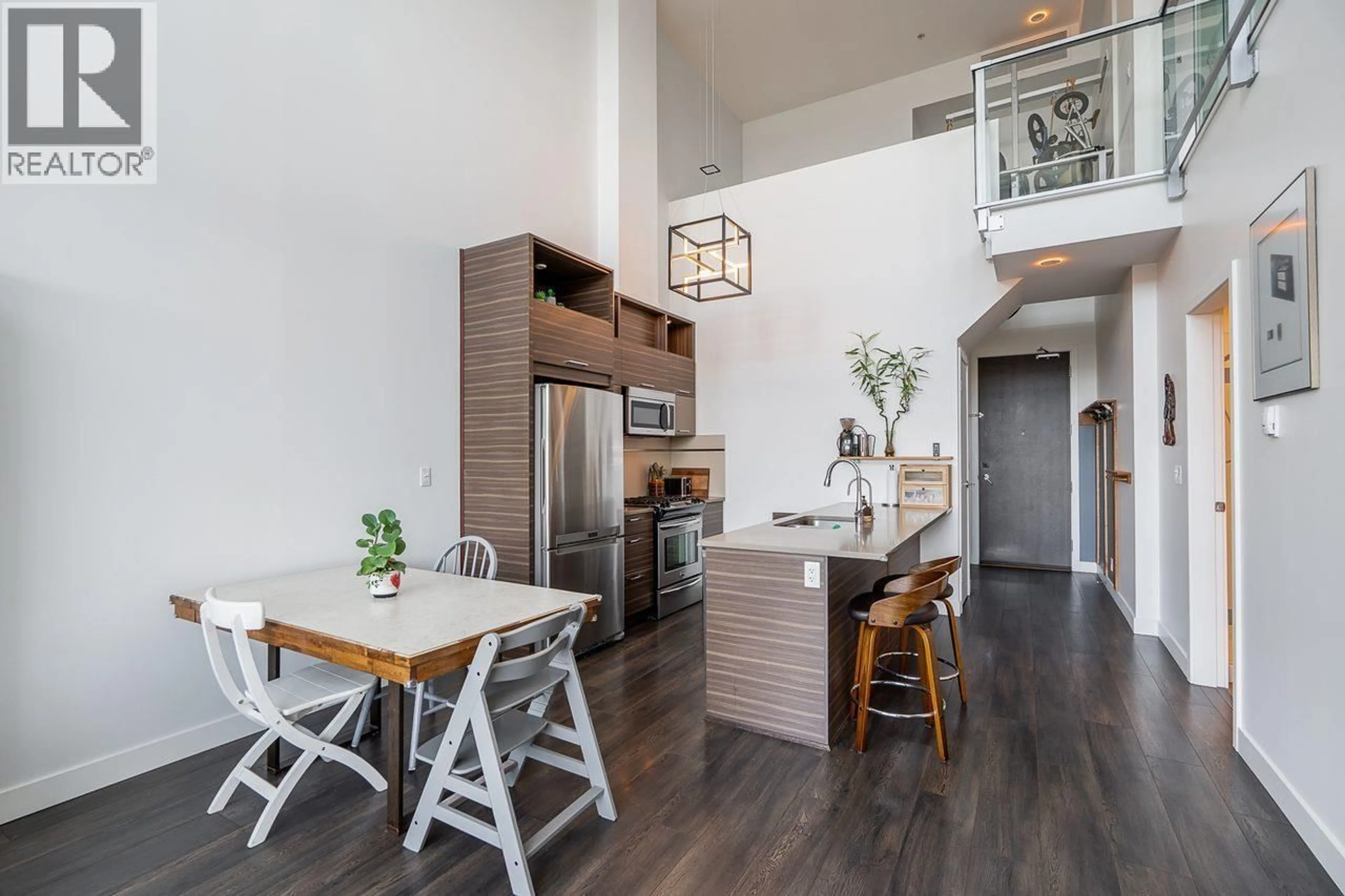 Open concept kitchen, wood/laminate floor for 401 - 9150 UNIVERSITY HIGH STREET, Burnaby British Columbia V5A0C5