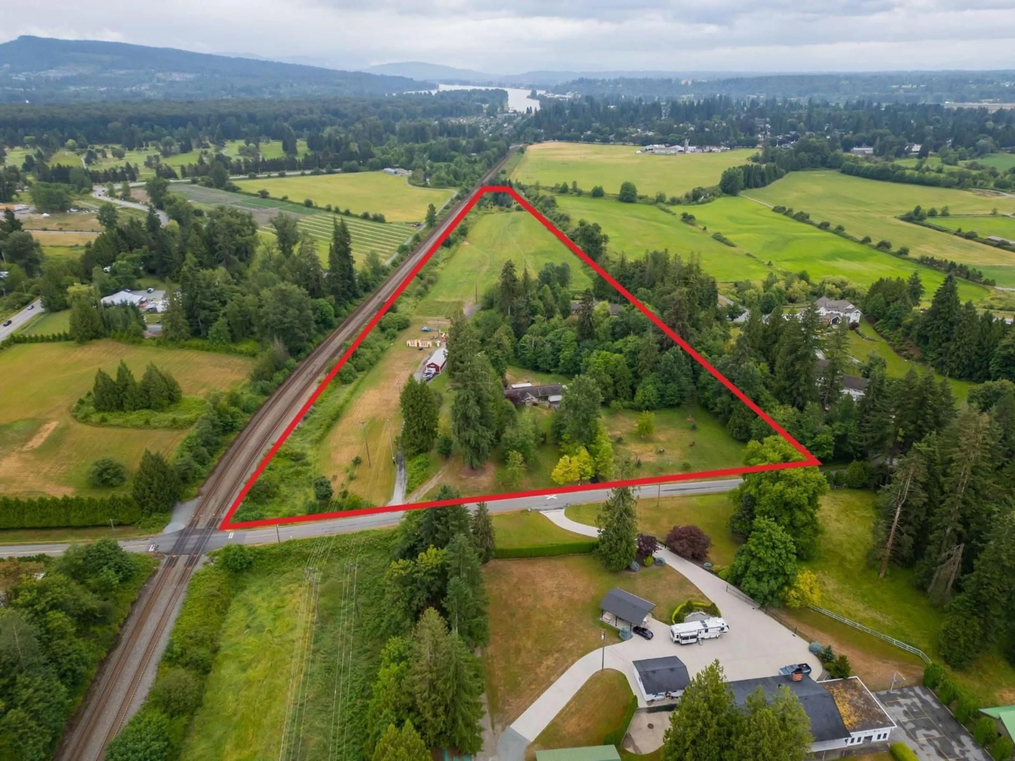 A pic from outside/outdoor area/front of a property/back of a property/a pic from drone, unknown for 9472 222 STREET, Langley British Columbia V1M3T7