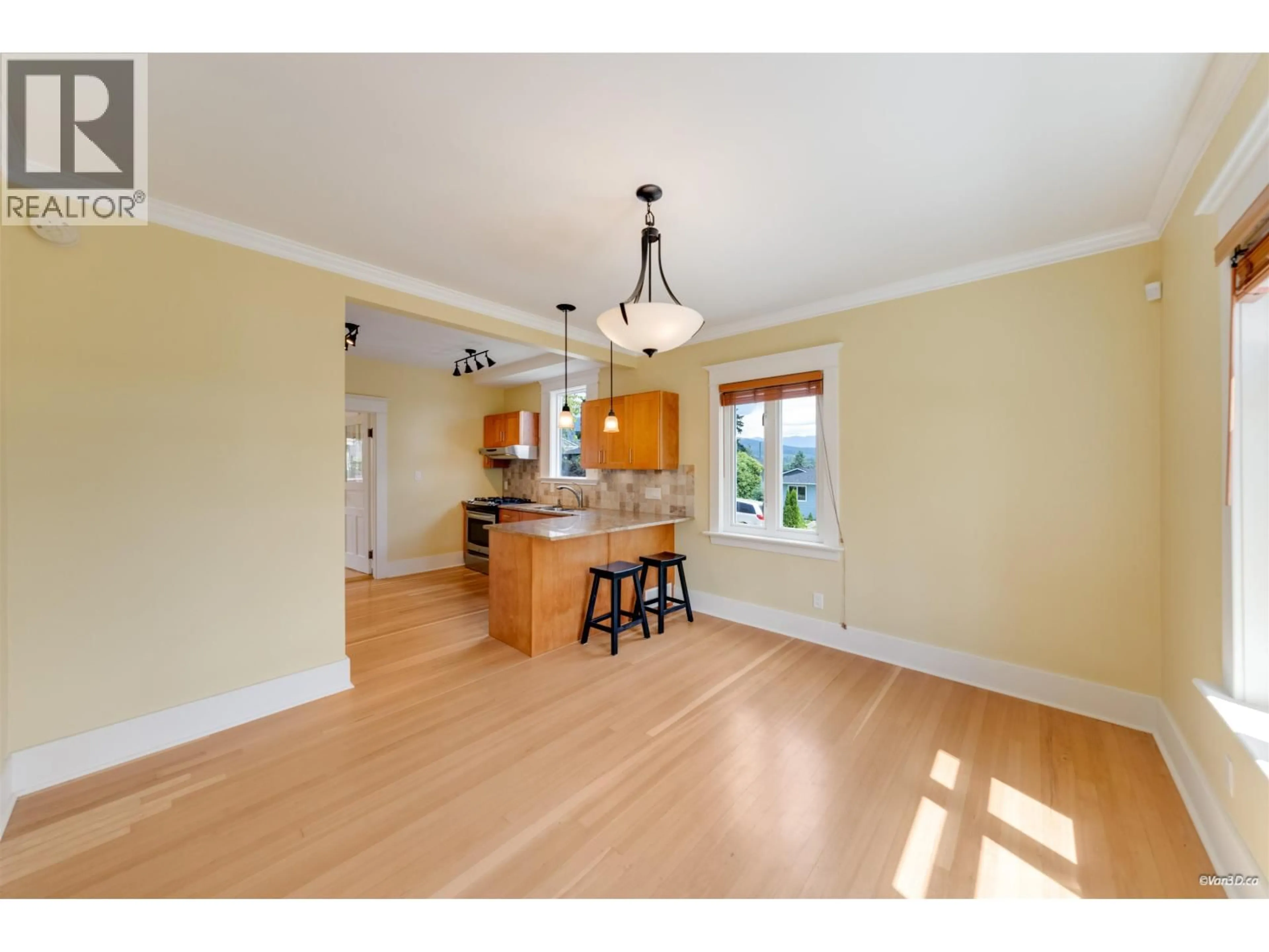 Open concept kitchen, wood/laminate floor for 848 6TH STREET, North Vancouver British Columbia V7L1R7