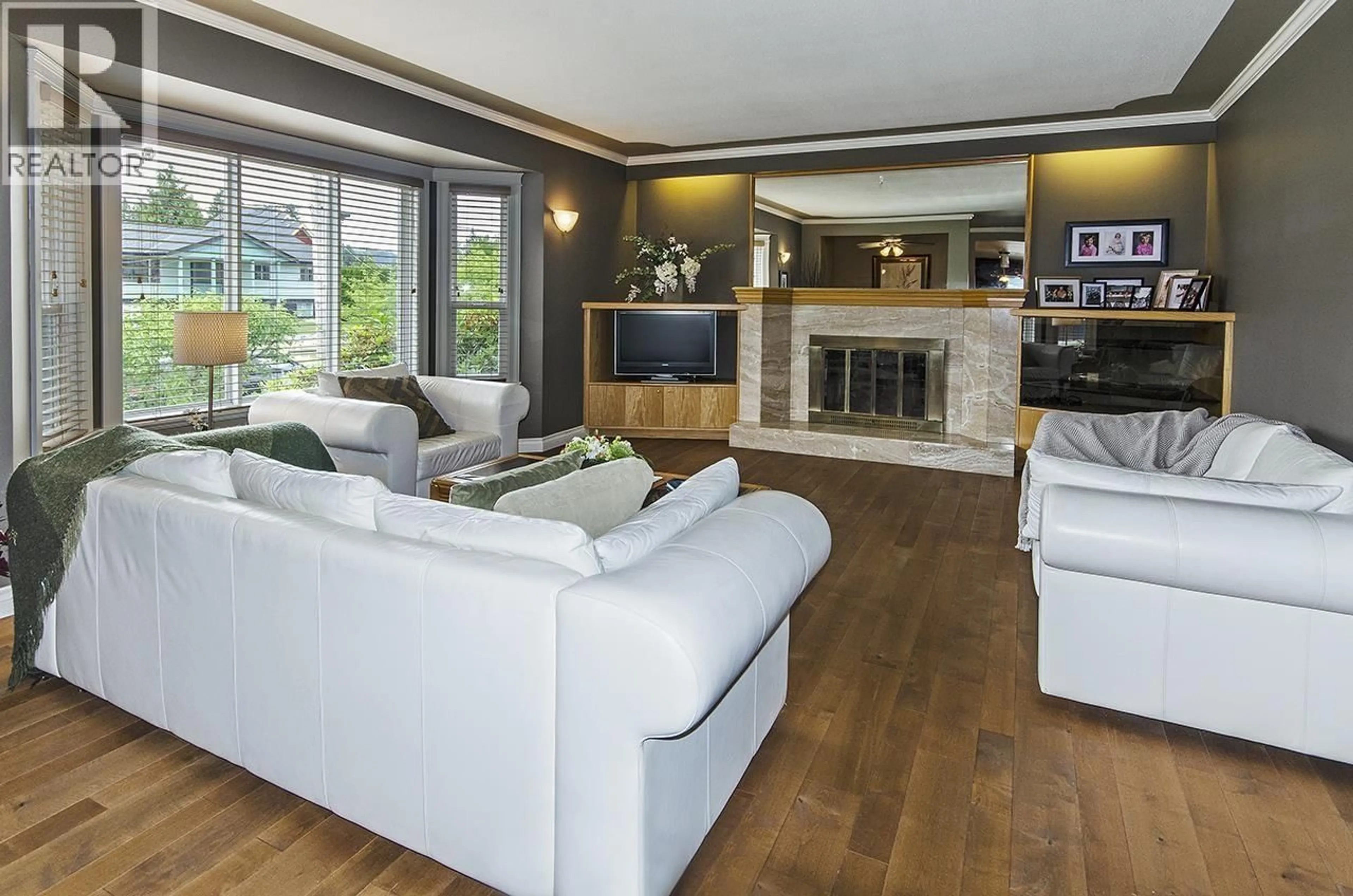 Living room with furniture, wood/laminate floor for 667 COLINET STREET, Coquitlam British Columbia V3J4X3