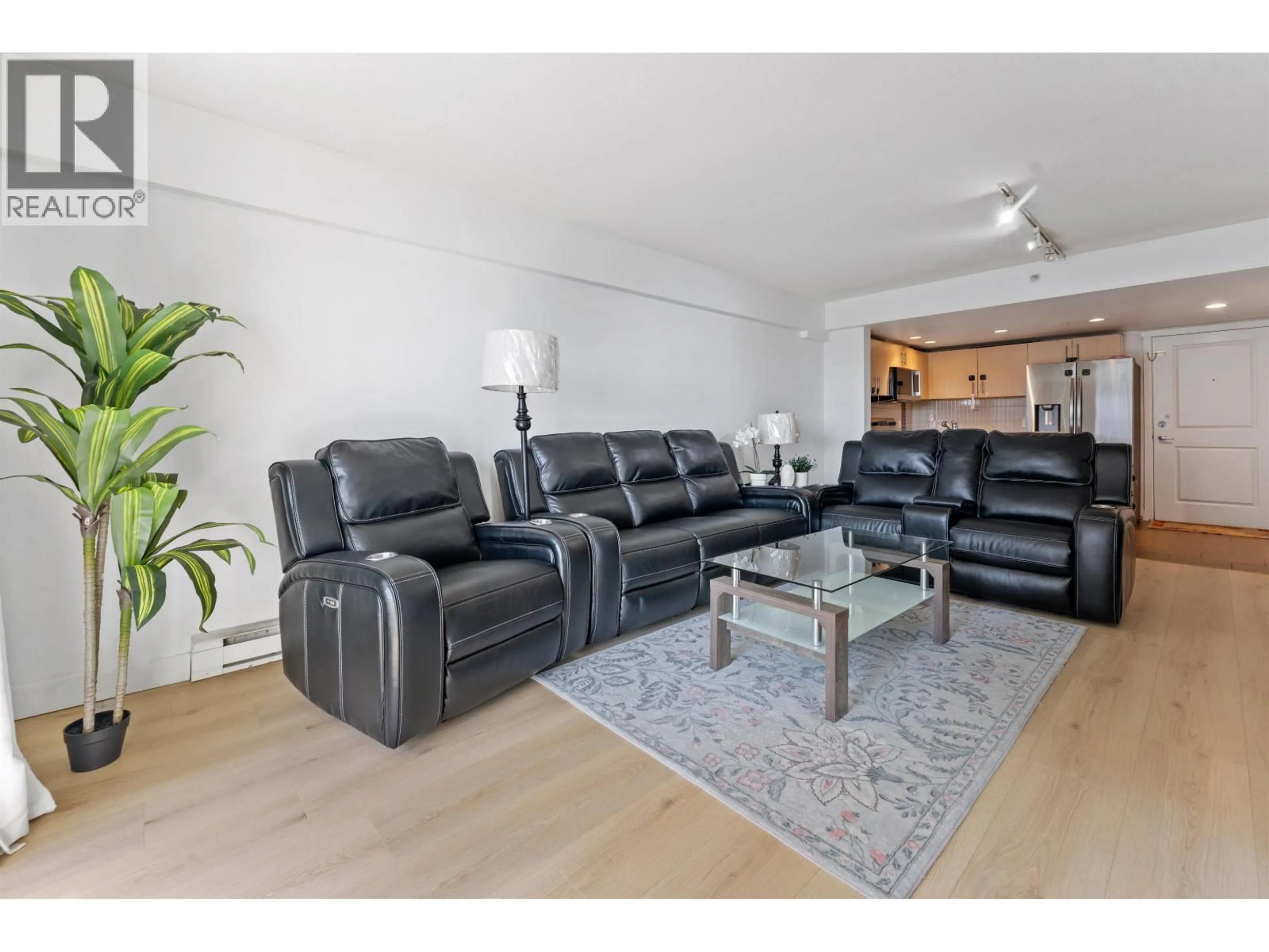 Living room with furniture, unknown for 606 - 200 KEARY STREET, New Westminster British Columbia V3L0A6