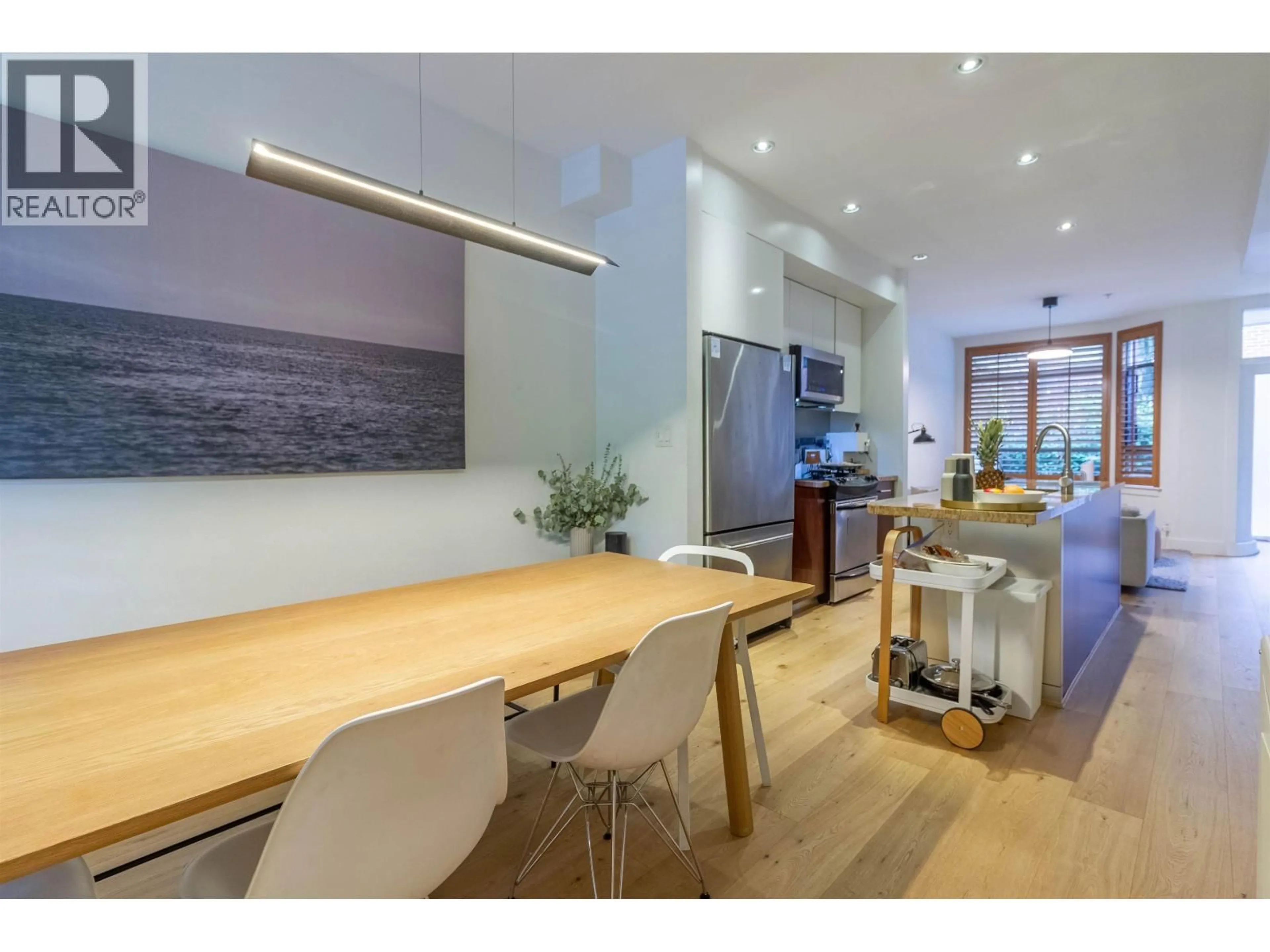 Open concept kitchen, wood/laminate floor for 822 6TH AVENUE, Vancouver British Columbia V5Z1A6