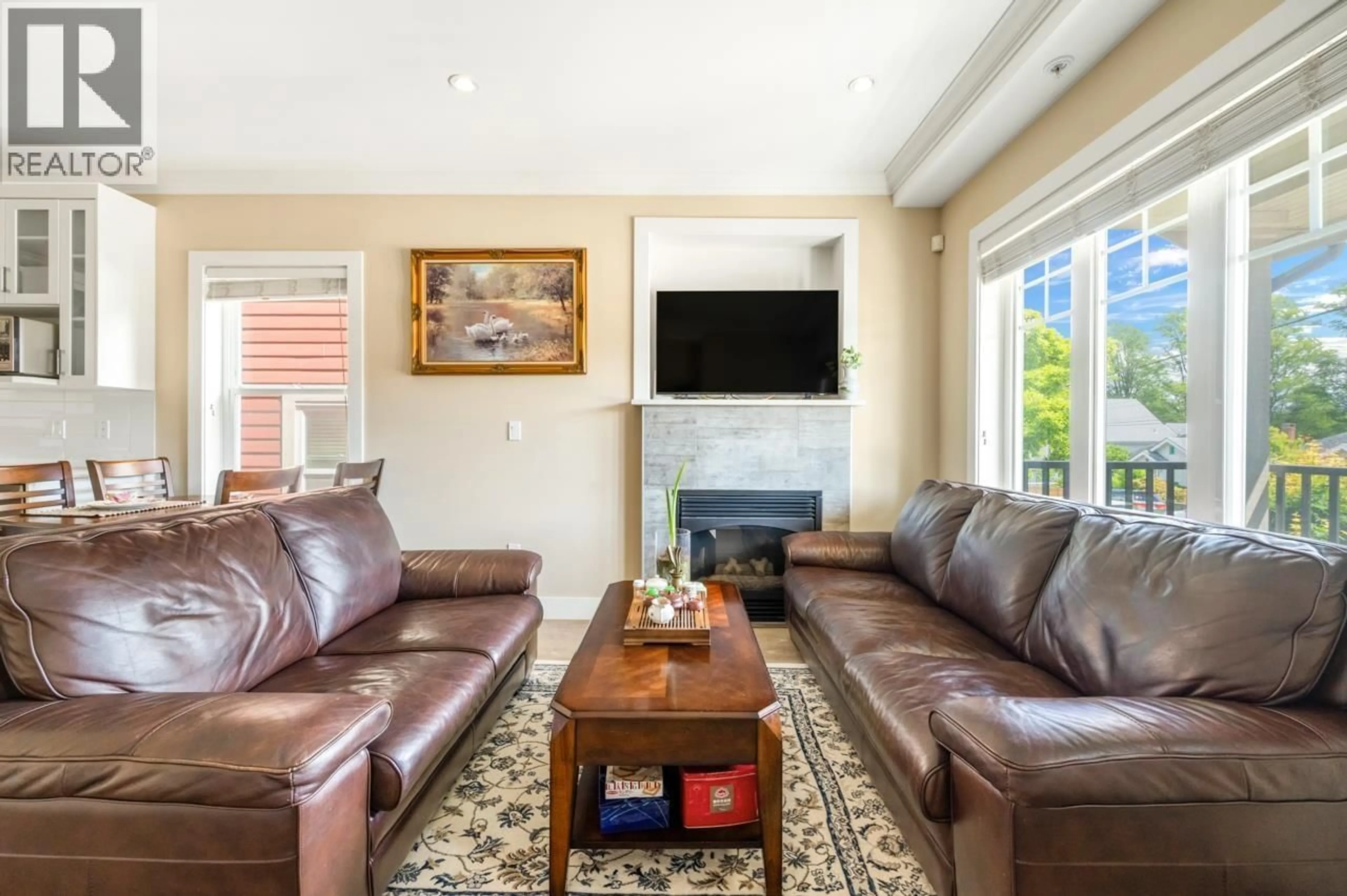 Living room with furniture, ceramic/tile floor for 201 - 4577 SLOCAN STREET, Vancouver British Columbia V5R1Z8