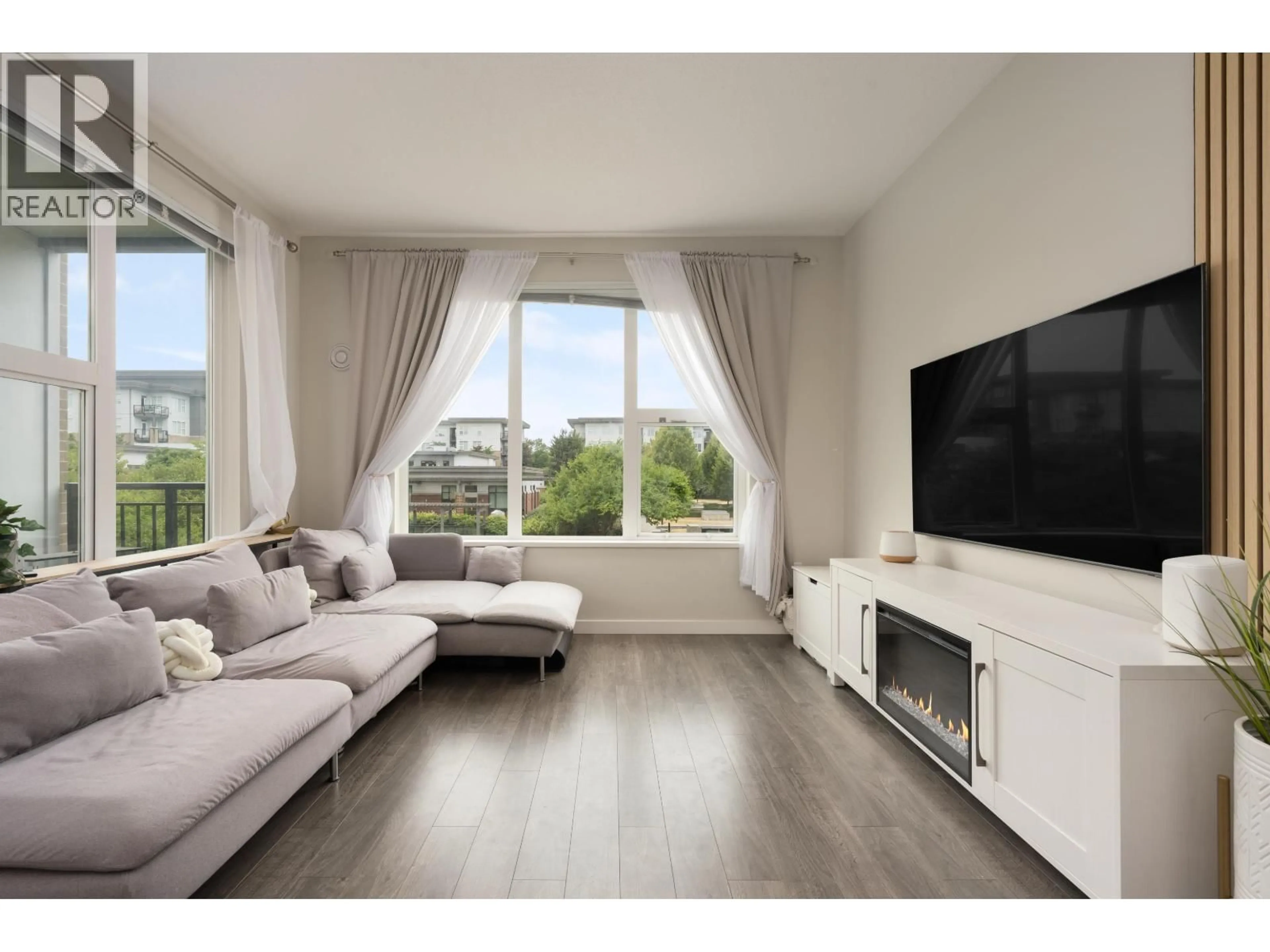 Living room with furniture, wood/laminate floor for 215 - 9388 TOMICKI AVENUE, Richmond British Columbia V6X0P1