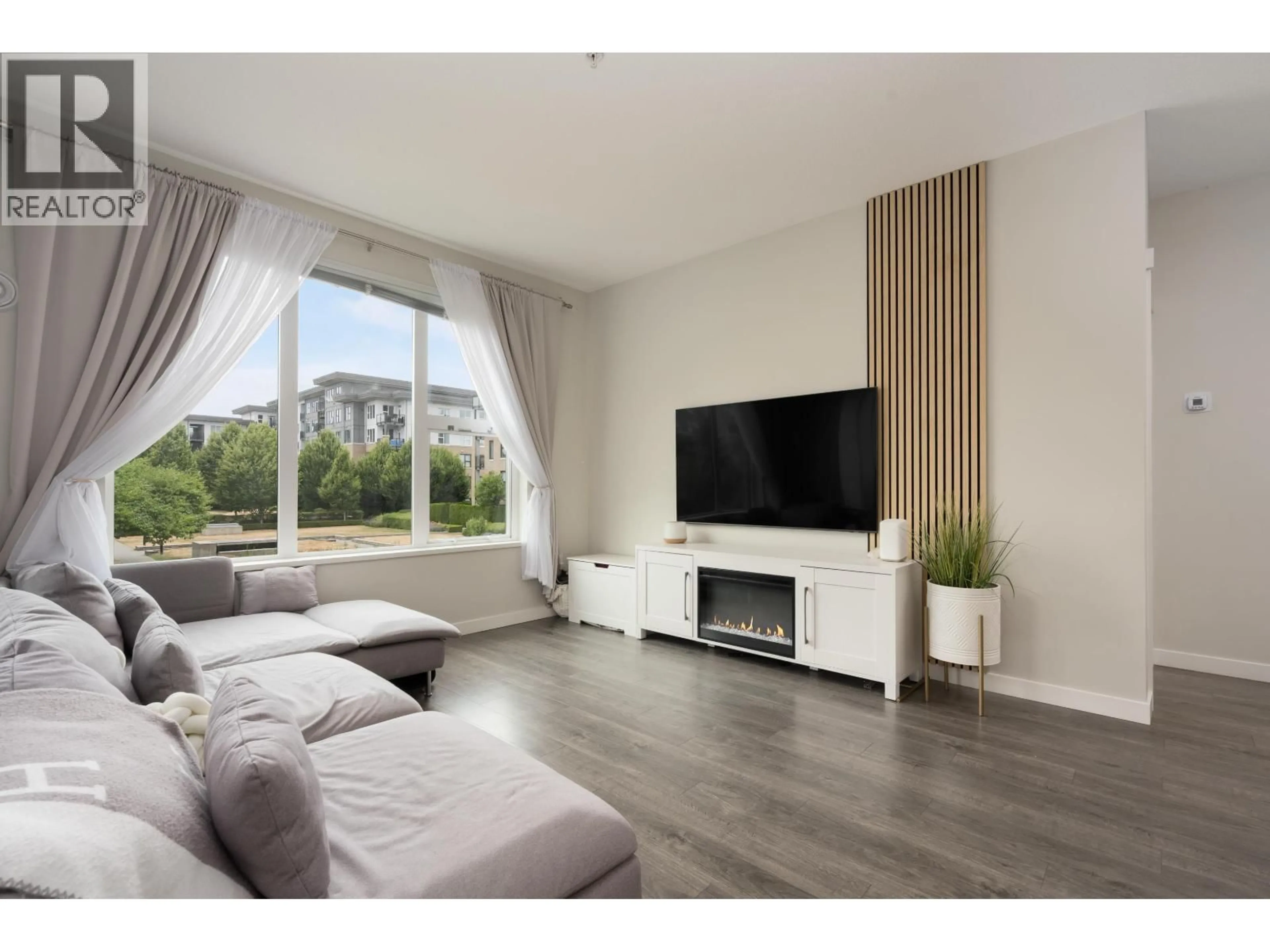 Living room with furniture, wood/laminate floor for 215 - 9388 TOMICKI AVENUE, Richmond British Columbia V6X0P1