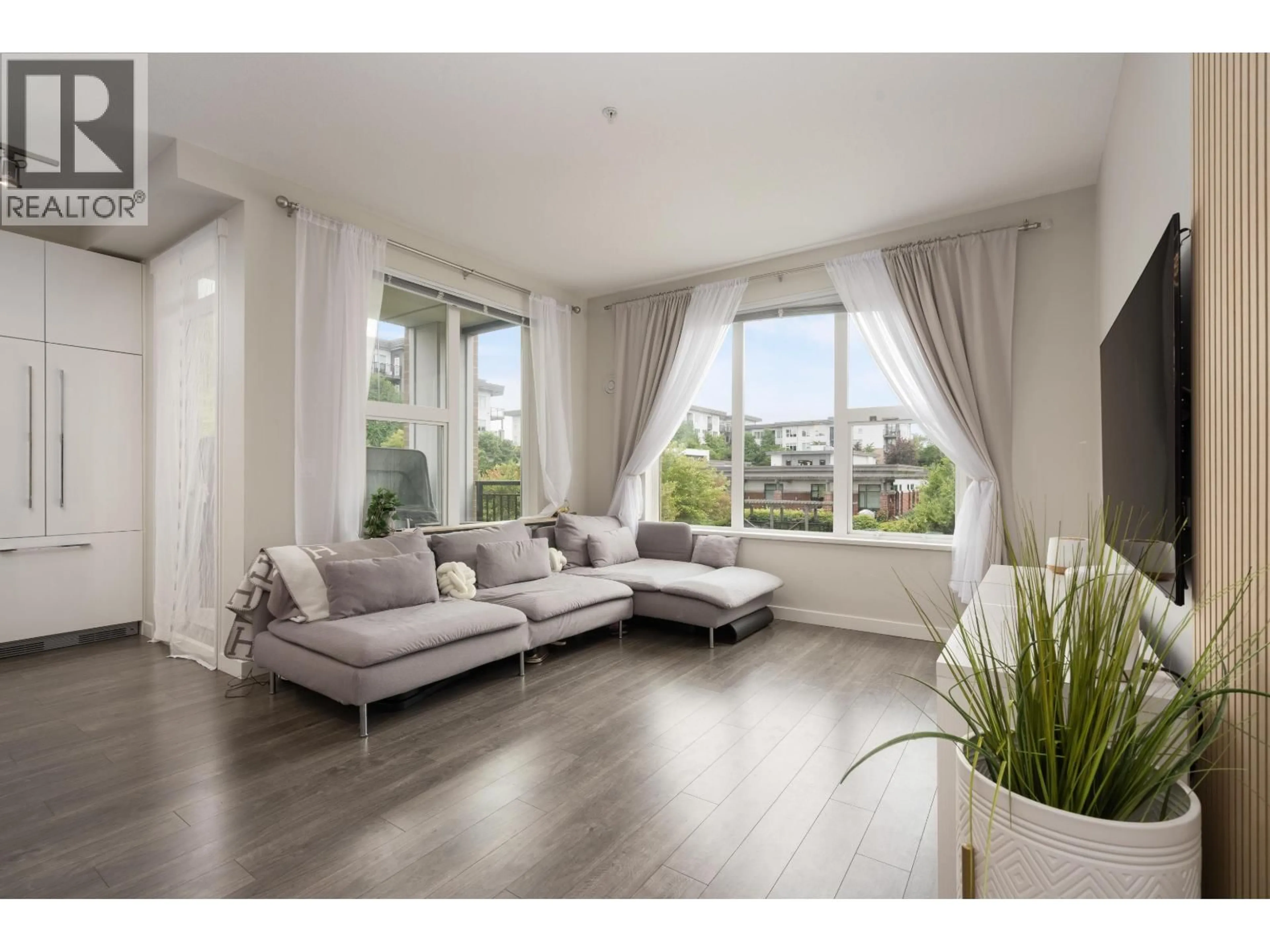 Living room with furniture, wood/laminate floor for 215 - 9388 TOMICKI AVENUE, Richmond British Columbia V6X0P1