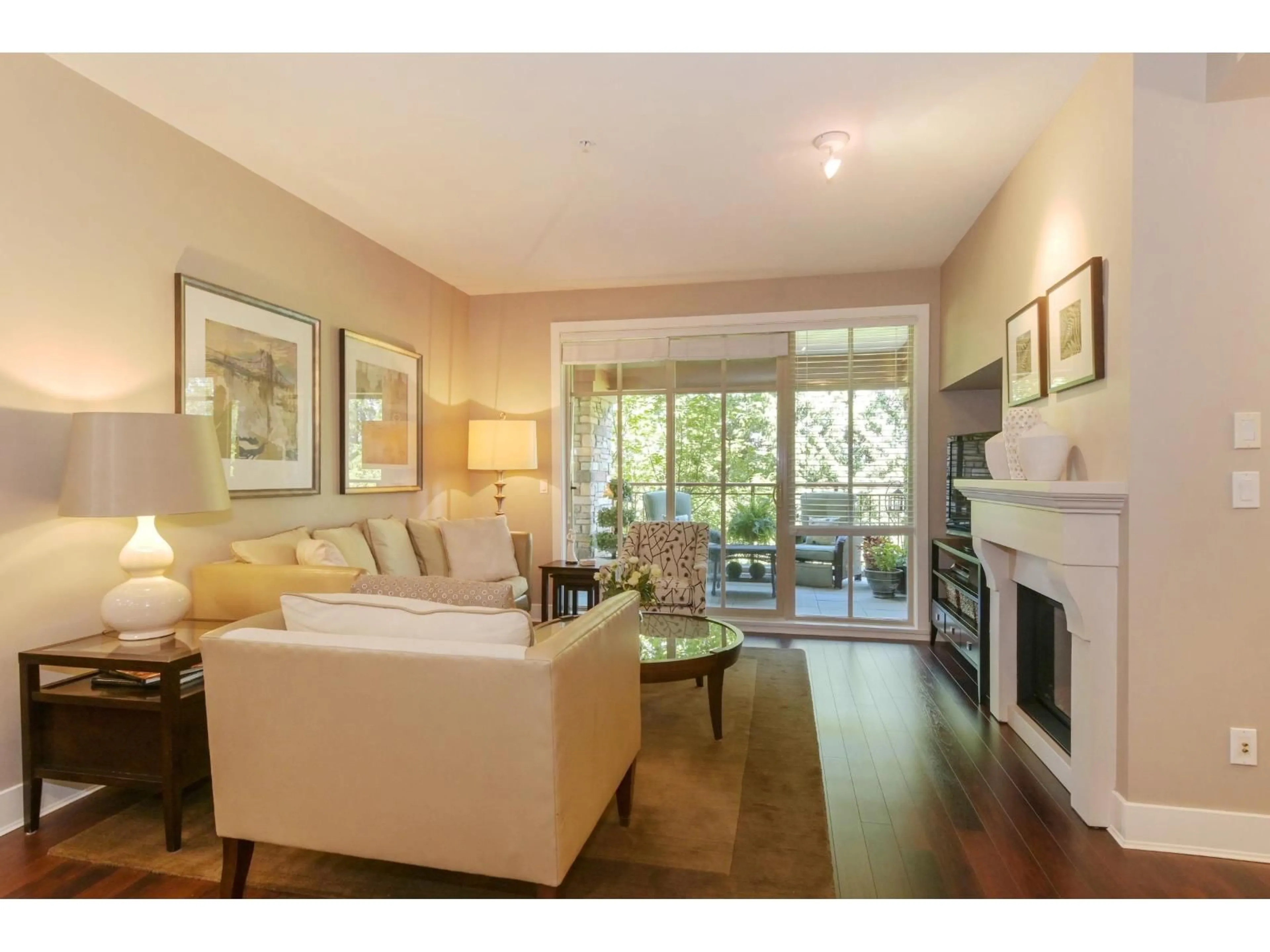 Living room with furniture, wood/laminate floor for 210 - 16477 64 AVENUE, Surrey British Columbia V3S6V7