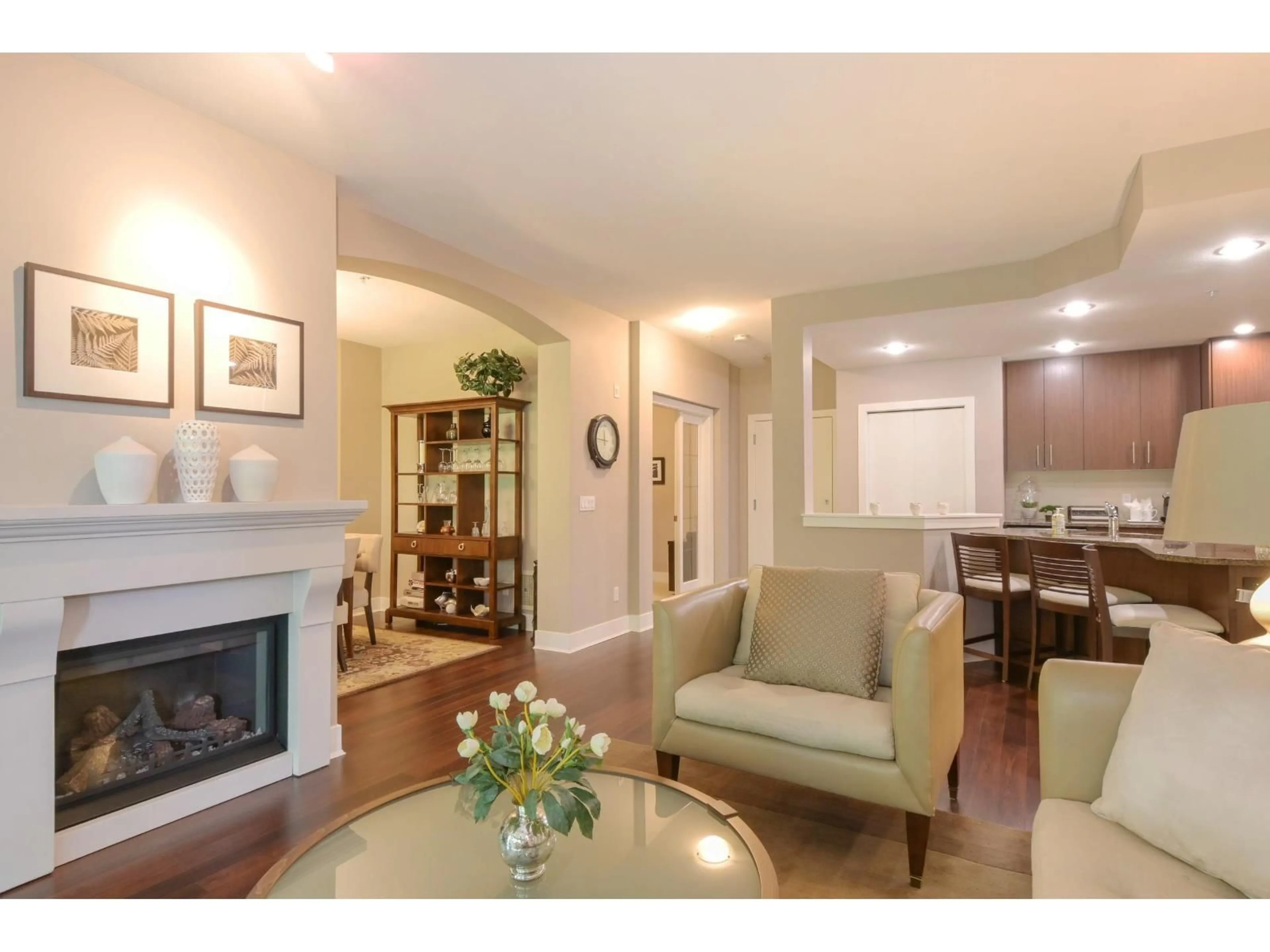 Living room with furniture, wood/laminate floor for 210 - 16477 64 AVENUE, Surrey British Columbia V3S6V7