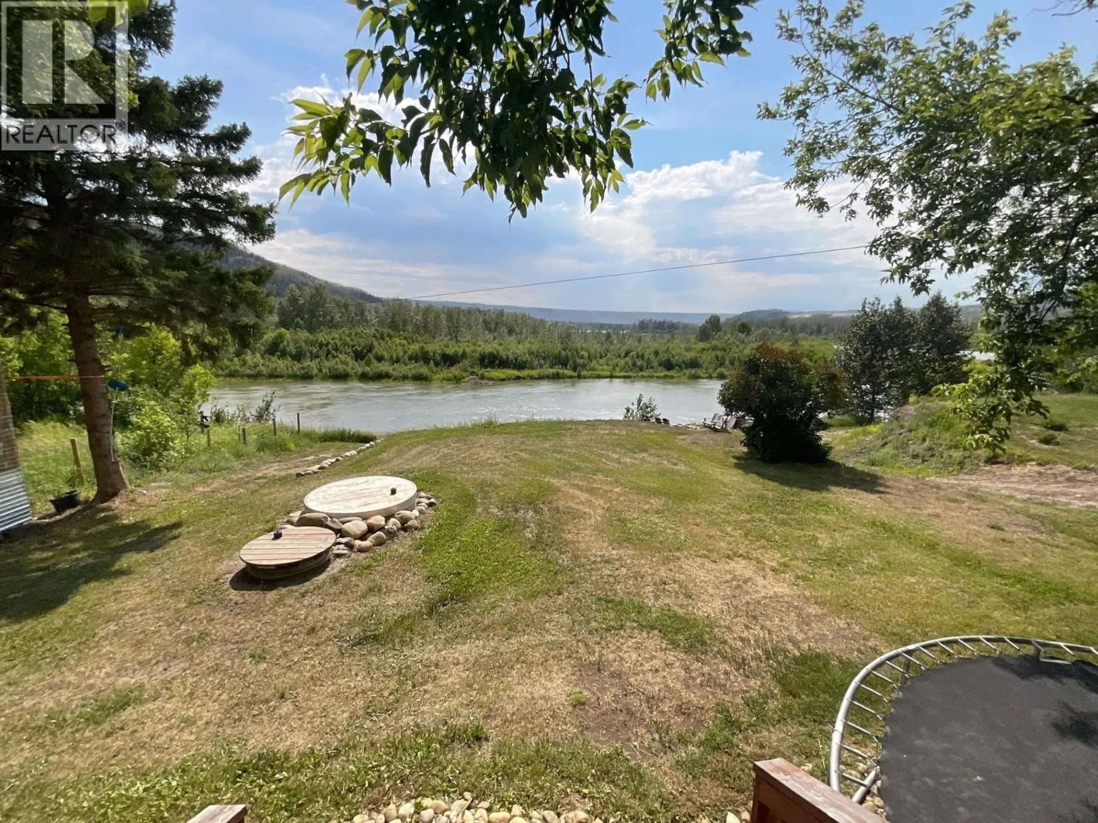 A pic from outside/outdoor area/front of a property/back of a property/a pic from drone, water/lake/river/ocean view for 9007 OLD FORT LOOP, Fort St. John British Columbia V1J4M7