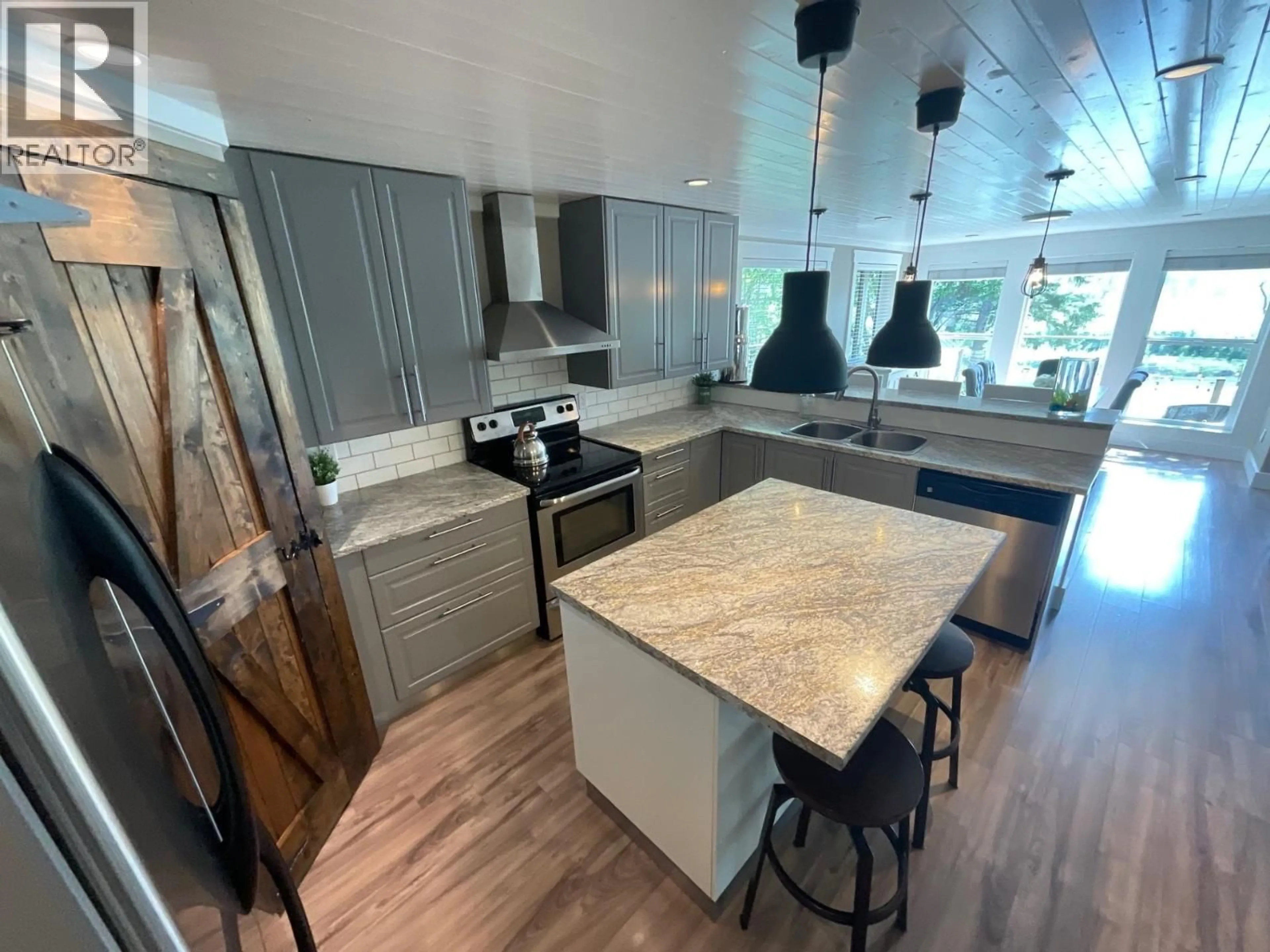 Open concept kitchen, unknown for 9007 OLD FORT LOOP, Fort St. John British Columbia V1J4M7
