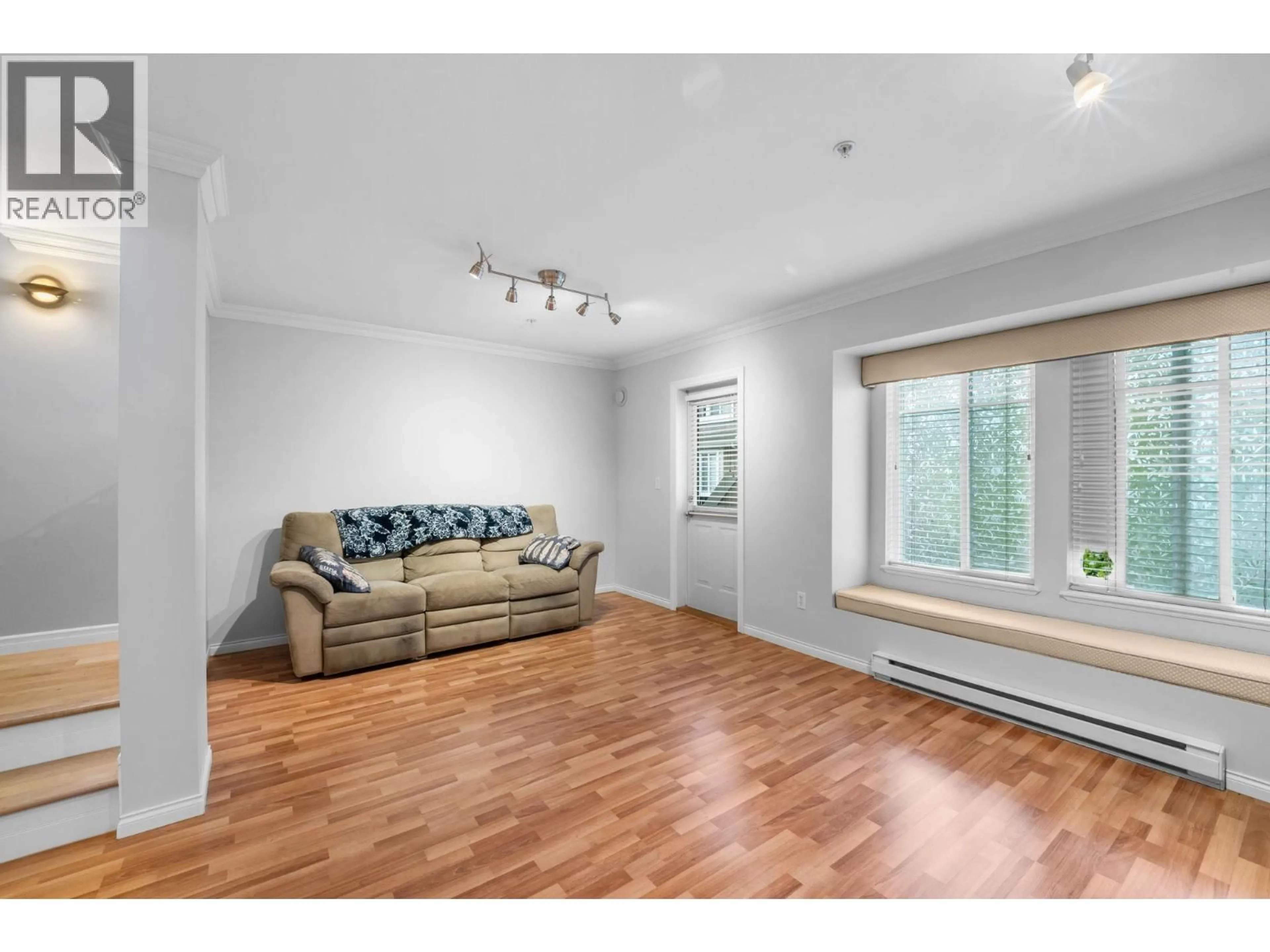 Living room with furniture, wood/laminate floor for 29 - 19141 124 AVENUE, Pitt Meadows British Columbia V3Y2V6