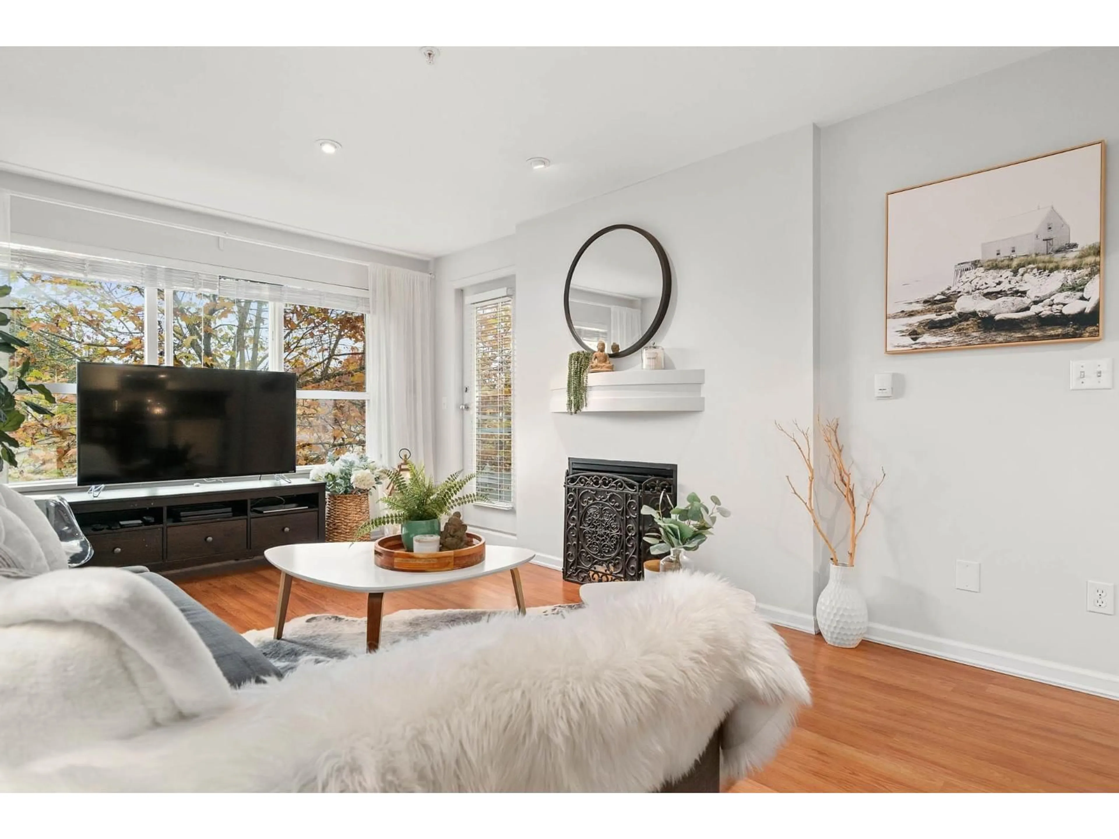 Living room with furniture, wood/laminate floor for 311 - 10188 155 STREET, Surrey British Columbia V3R0R6