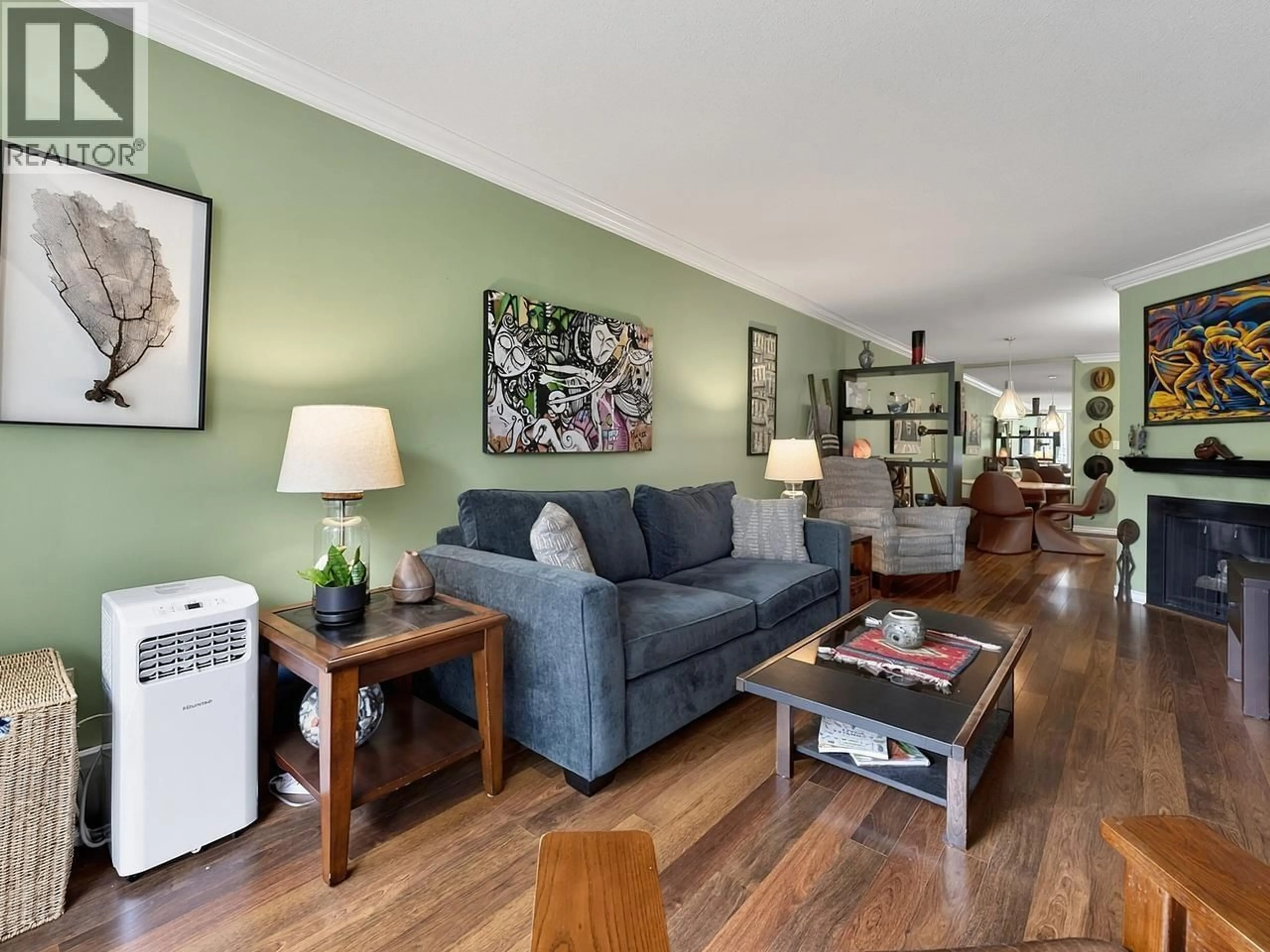 Living room with furniture, wood/laminate floor for 112 - 9151 NO 5 ROAD, Richmond British Columbia V7A4T9