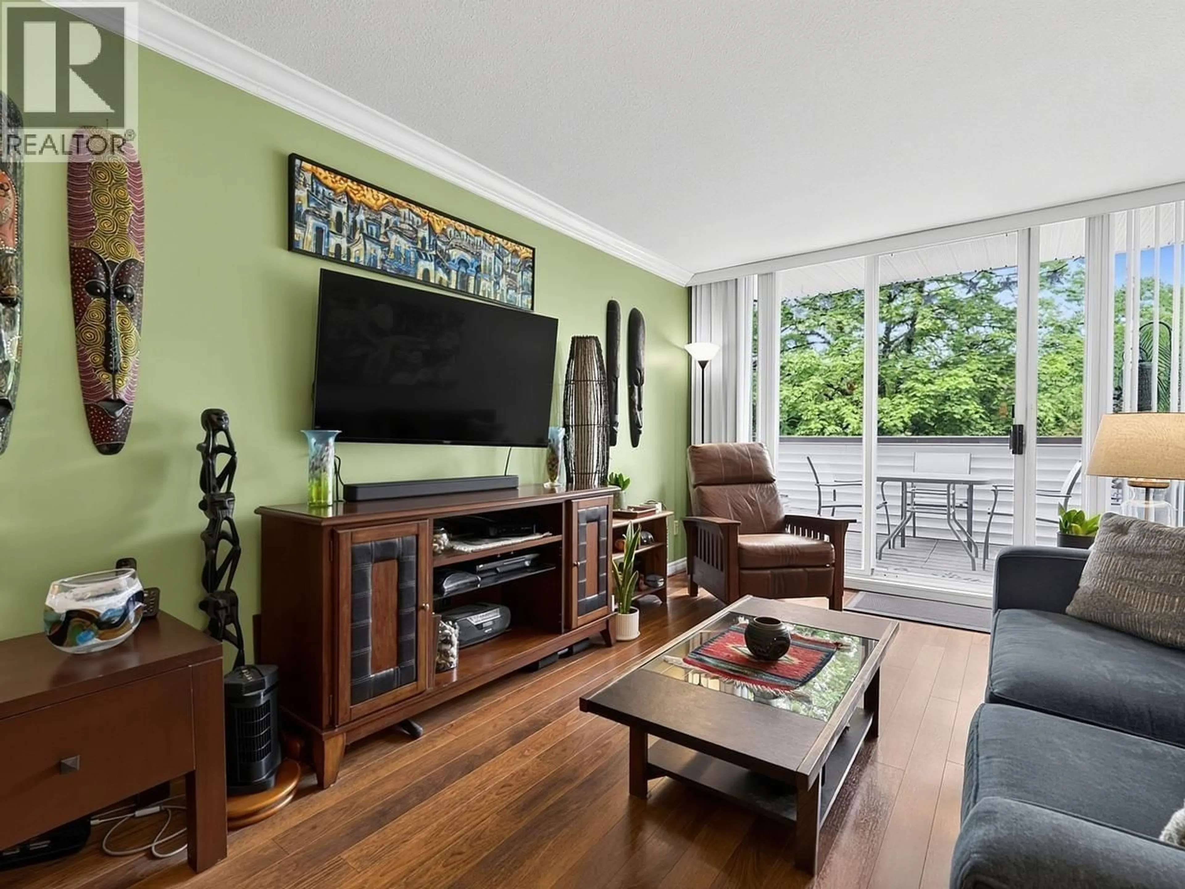 Living room with furniture, wood/laminate floor for 112 - 9151 NO 5 ROAD, Richmond British Columbia V7A4T9