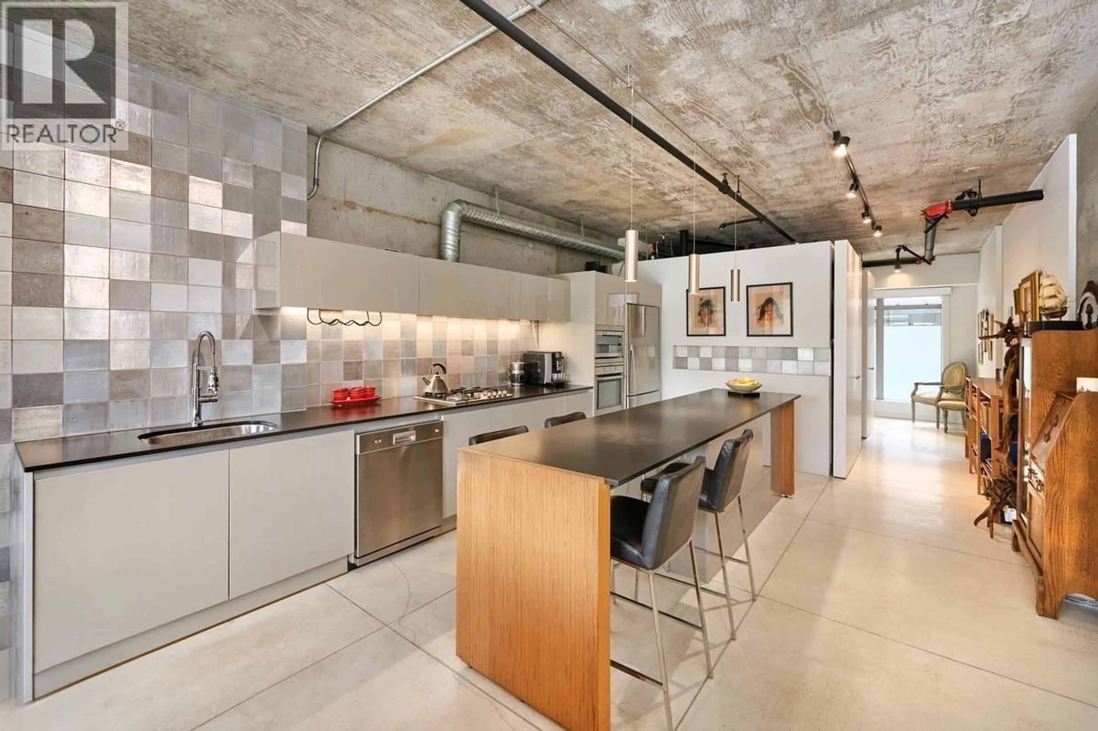 Contemporary kitchen, cement floor for 205 - 1529 6  AVENUE WEST AVENUE, Vancouver British Columbia V6J1R1