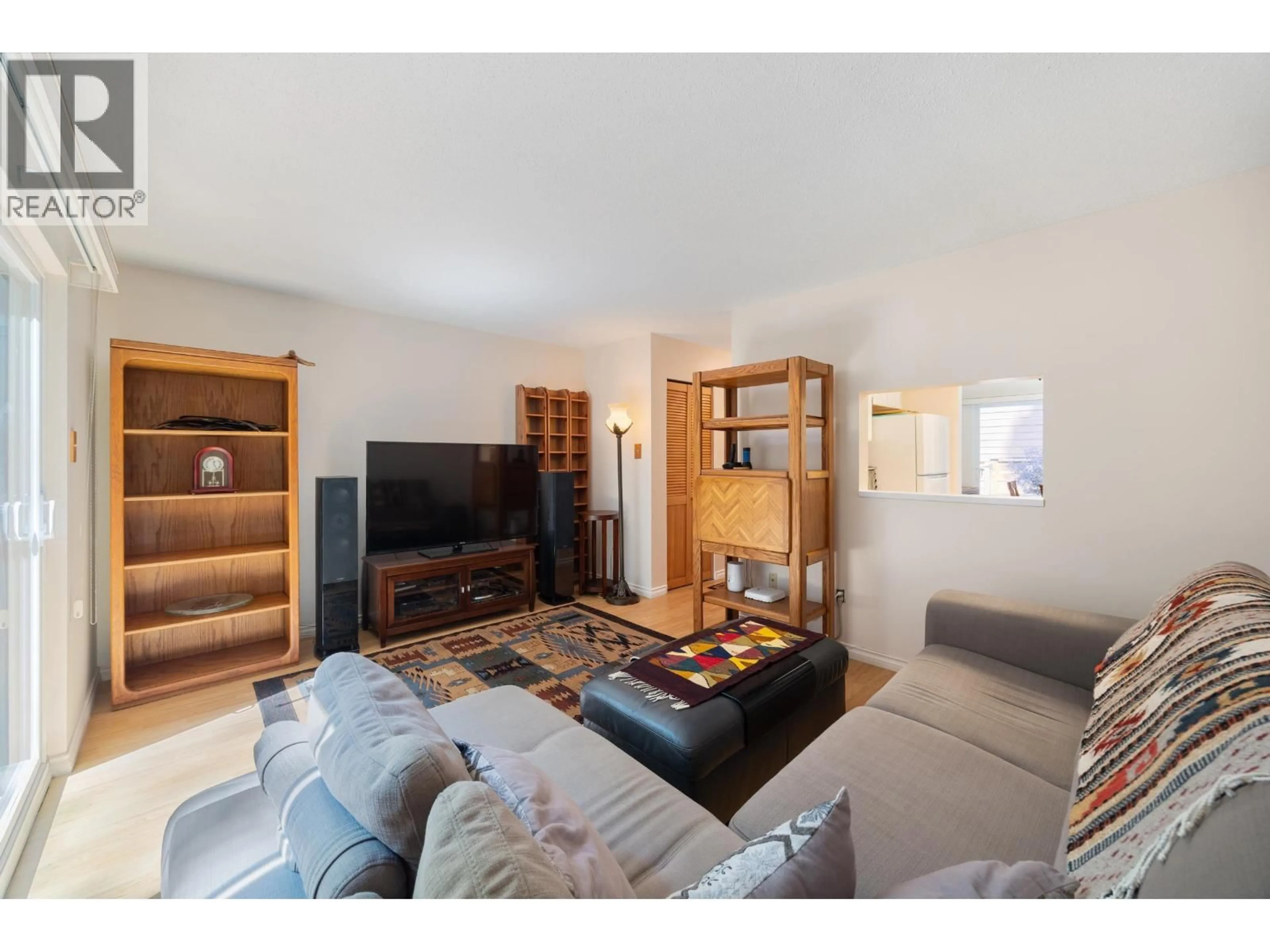 Living room with furniture, wood/laminate floor for 4384 GARDEN GROVE DRIVE, Burnaby British Columbia V5G4G6