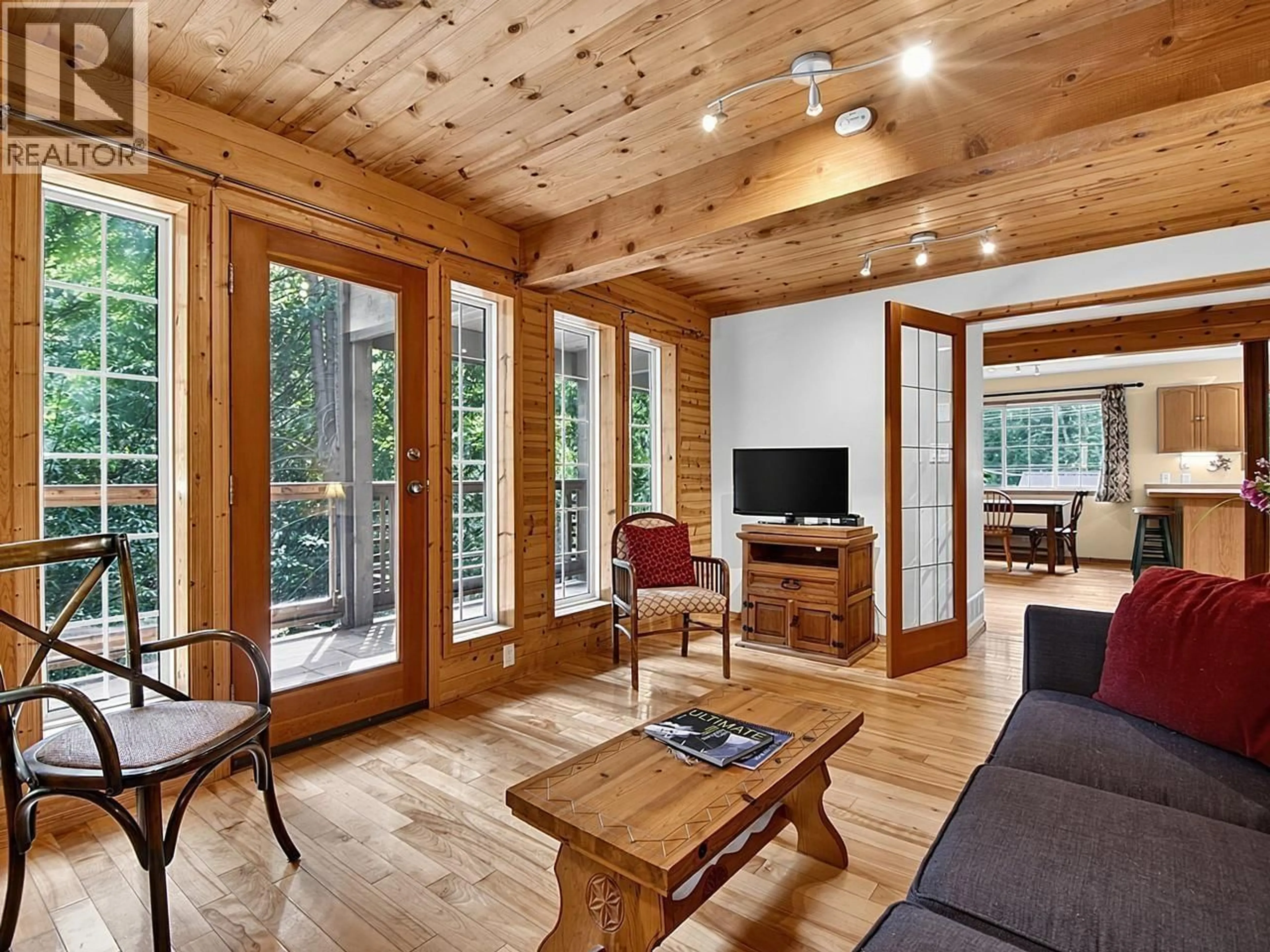 Living room with furniture, wood/laminate floor for 1099 MILLER ROAD, Bowen Island British Columbia V0N1G1