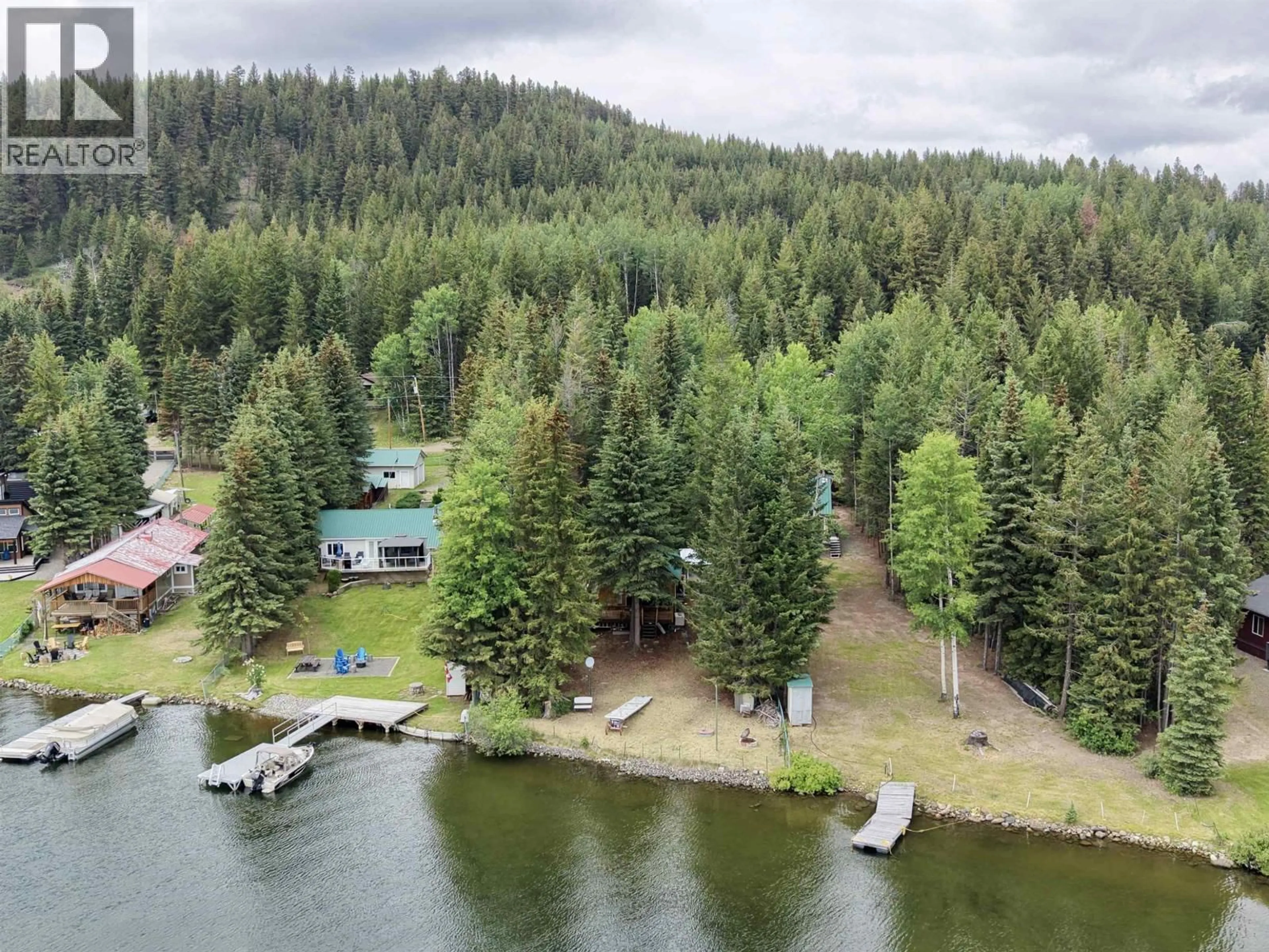 A pic from outside/outdoor area/front of a property/back of a property/a pic from drone, water/lake/river/ocean view for 7640 BURGESS ROAD, 100 Mile House British Columbia V0K1X3