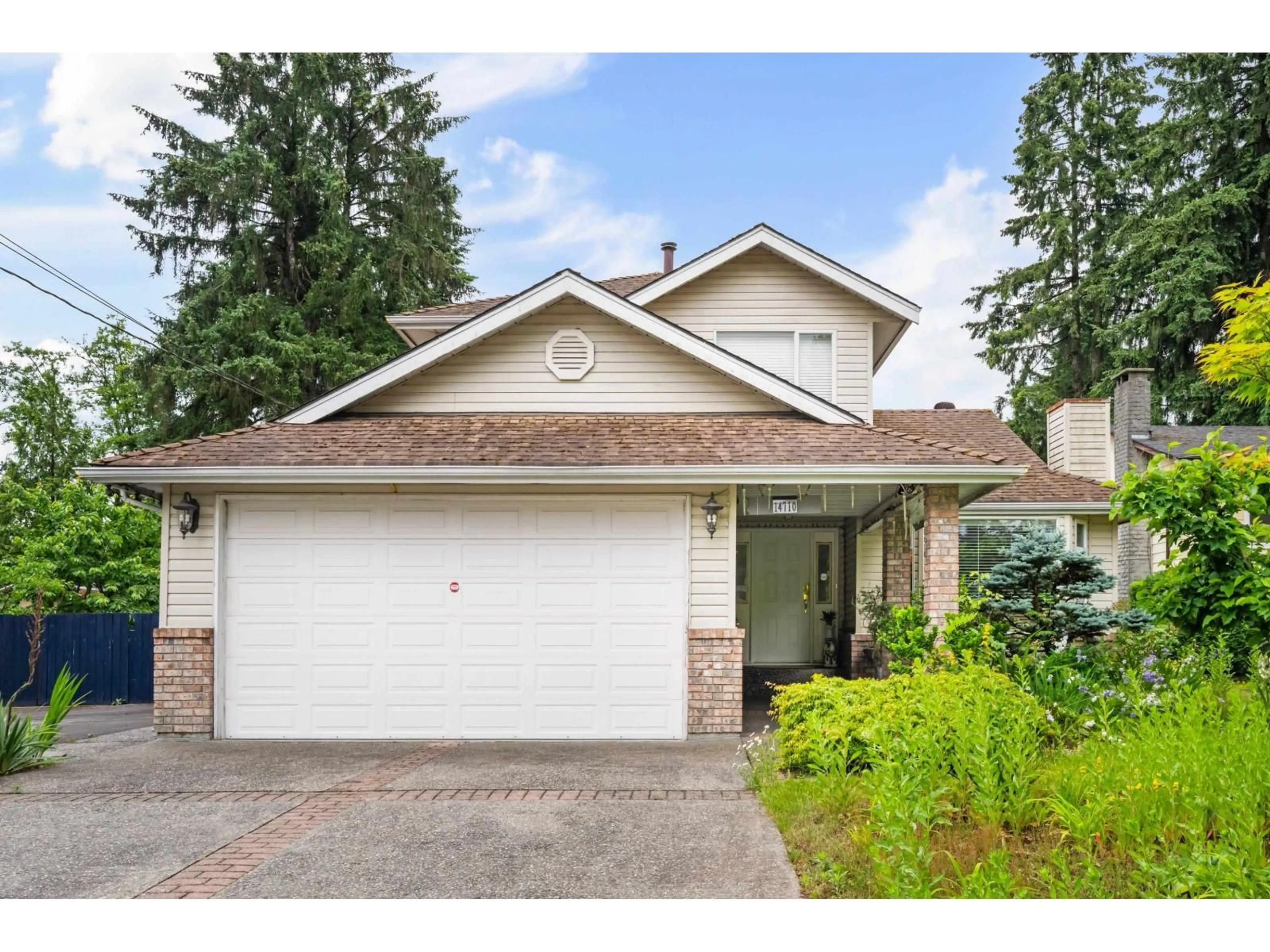 Home with vinyl exterior material, street for 14710 106 AVENUE, Surrey British Columbia V3R5Y1