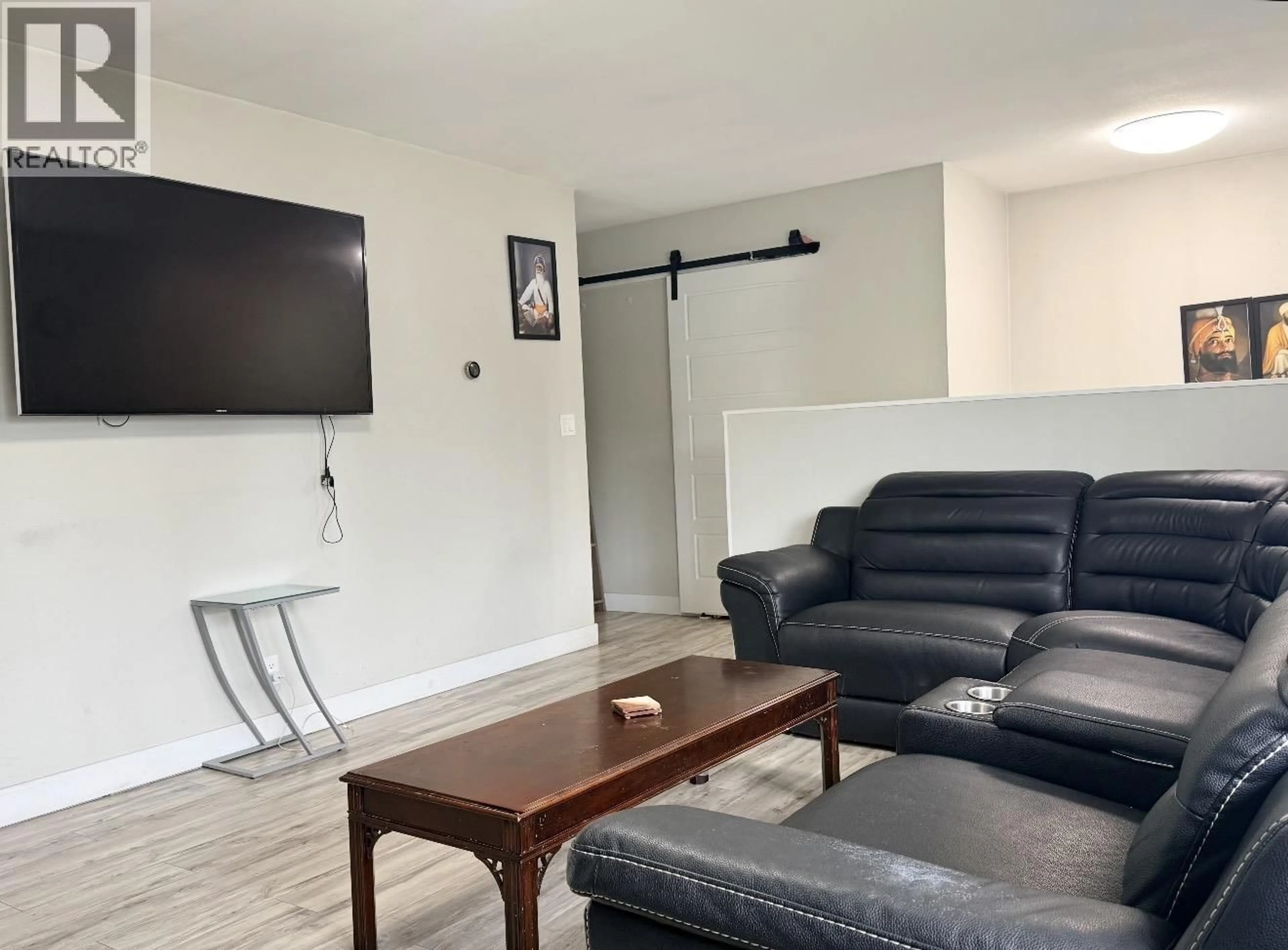 Living room with furniture, wood/laminate floor for 14 GANNET CRESCENT, Kitimat British Columbia V8C1P3
