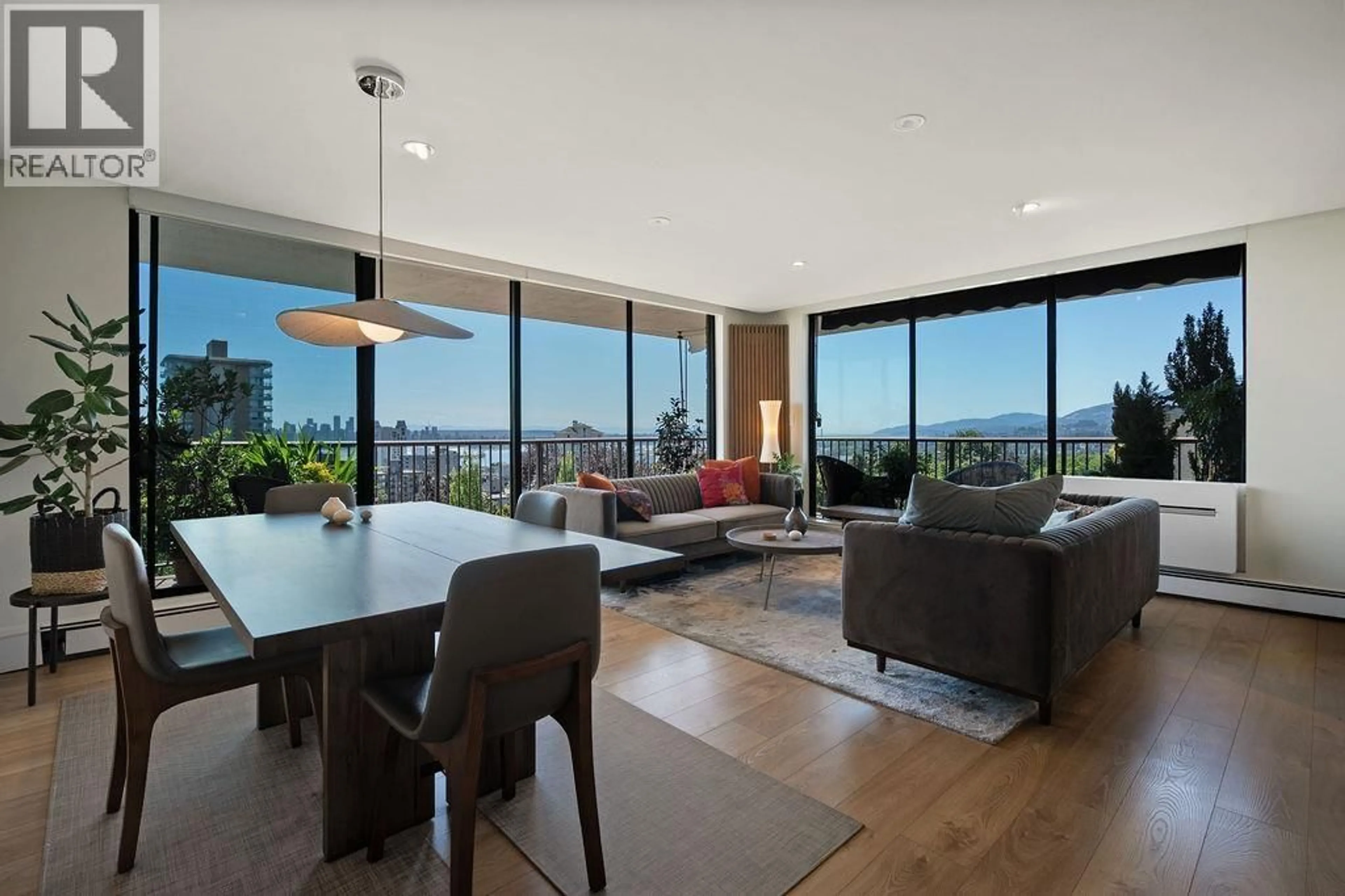 Living room with furniture, wood/laminate floor for 701 - 140 KEITH ROAD, North Vancouver British Columbia V7L4M9
