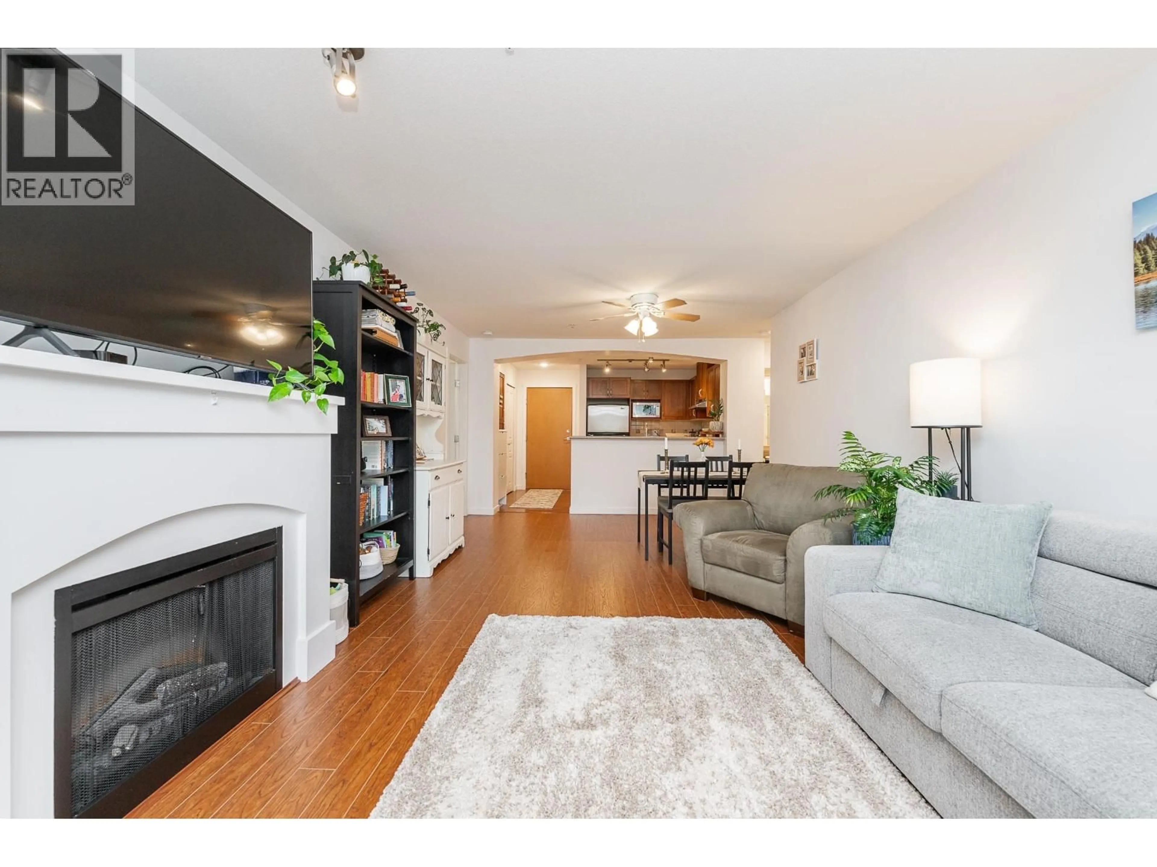 Living room with furniture, wood/laminate floor for 201 - 2951 SILVER SPRINGS BOULEVARD, Coquitlam British Columbia V3E3S4