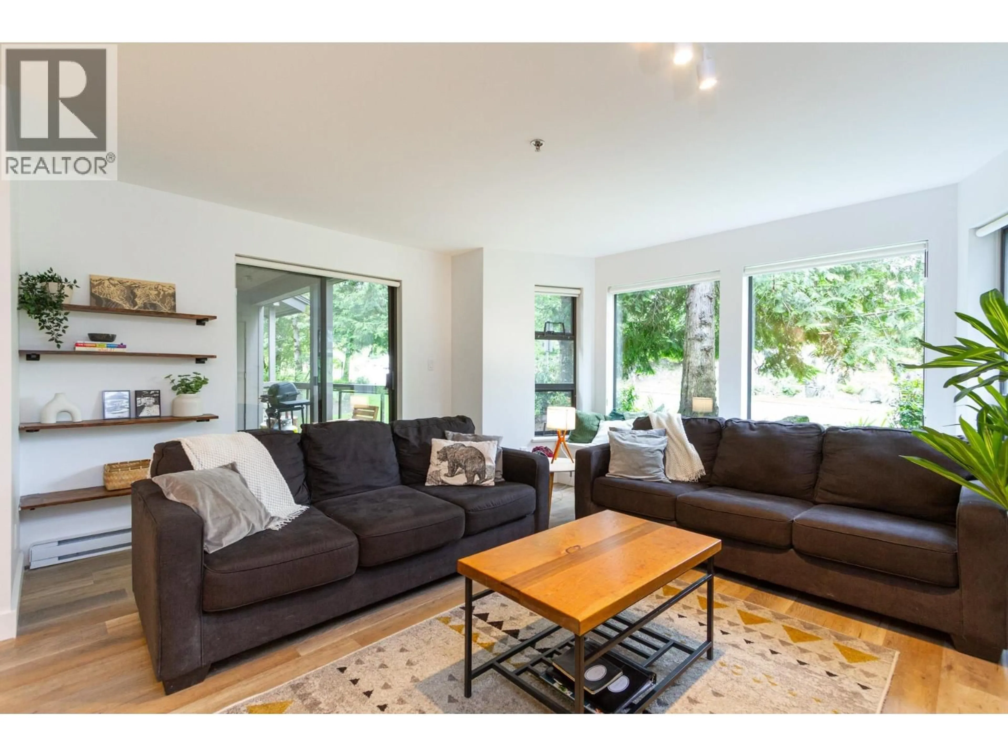 Living room with furniture, wood/laminate floor for 122 - 3309 PTARMIGAN PLACE, Whistler British Columbia V8E0V6