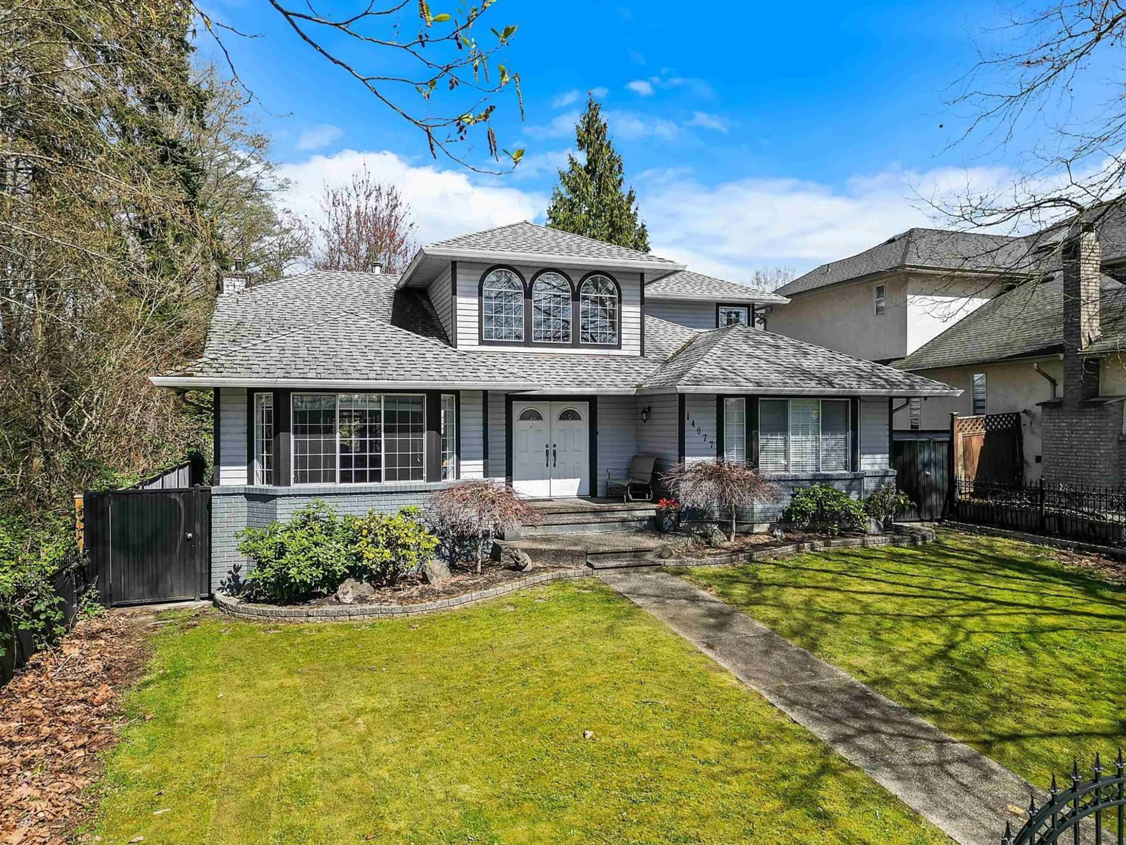 Home with vinyl exterior material, street for 14077 84 AVENUE, Surrey British Columbia V3W0V5
