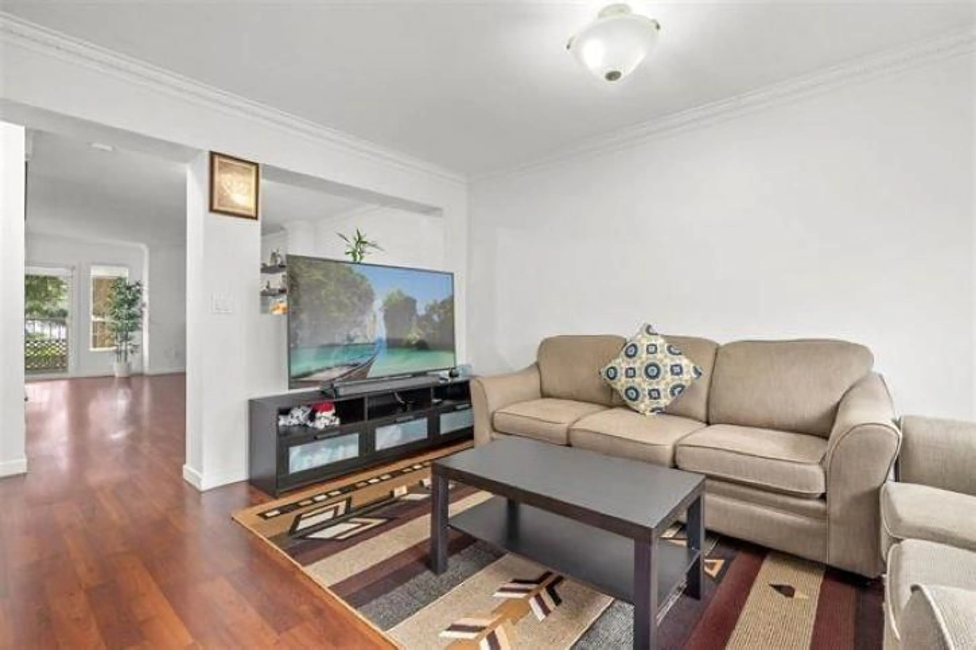 Living room with furniture, wood/laminate floor for 40 - 12738 66 AVENUE, Surrey British Columbia V3W1P3