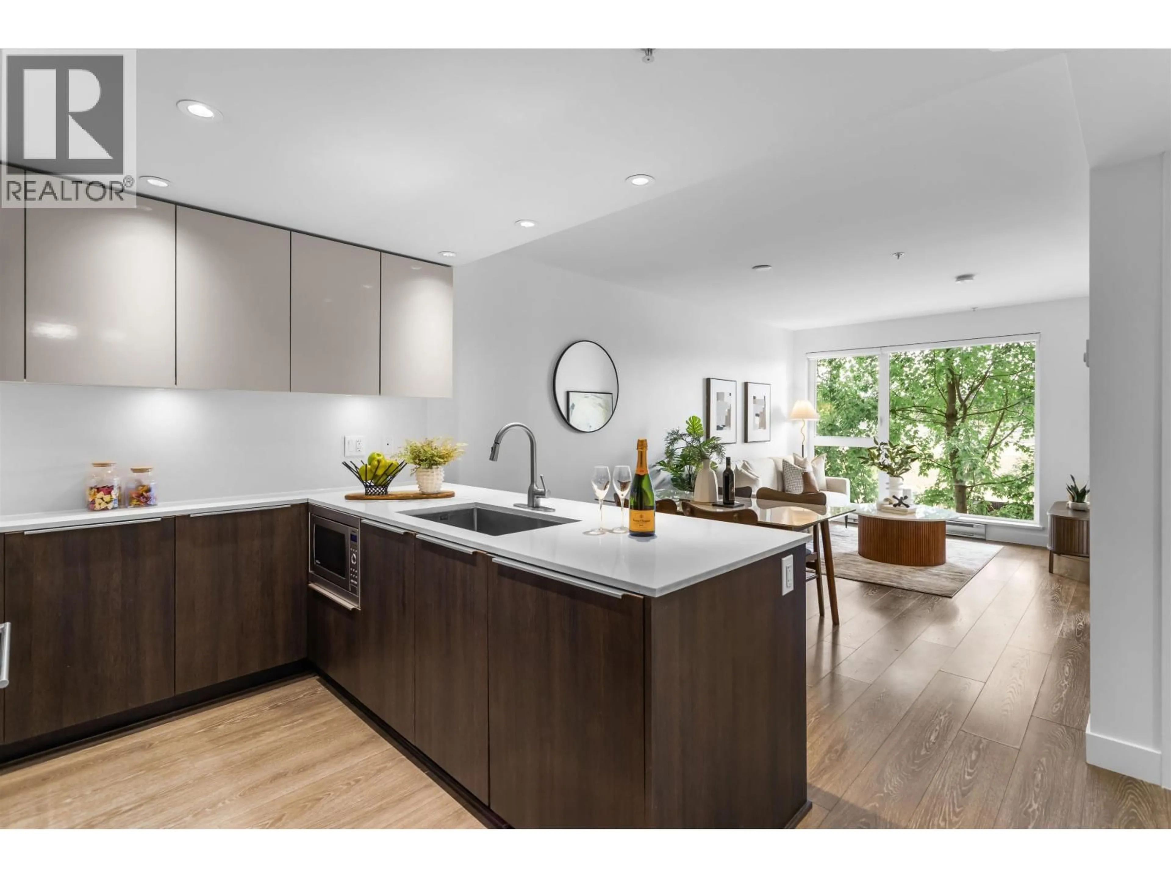 Open concept kitchen, wood/laminate floor for 211 - 1588 HASTINGS STREET, Vancouver British Columbia V5L0B8
