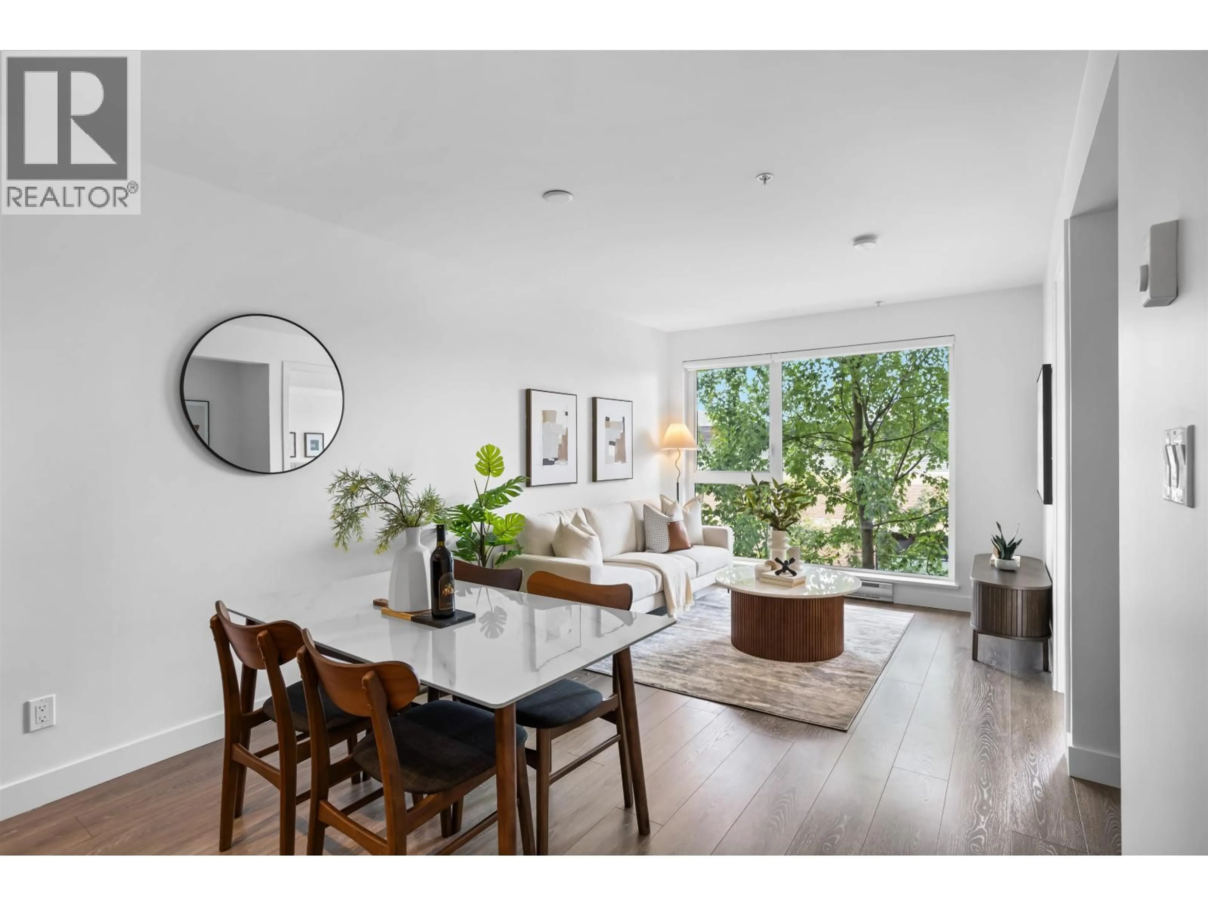 Living room with furniture, wood/laminate floor for 211 - 1588 HASTINGS STREET, Vancouver British Columbia V5L0B8