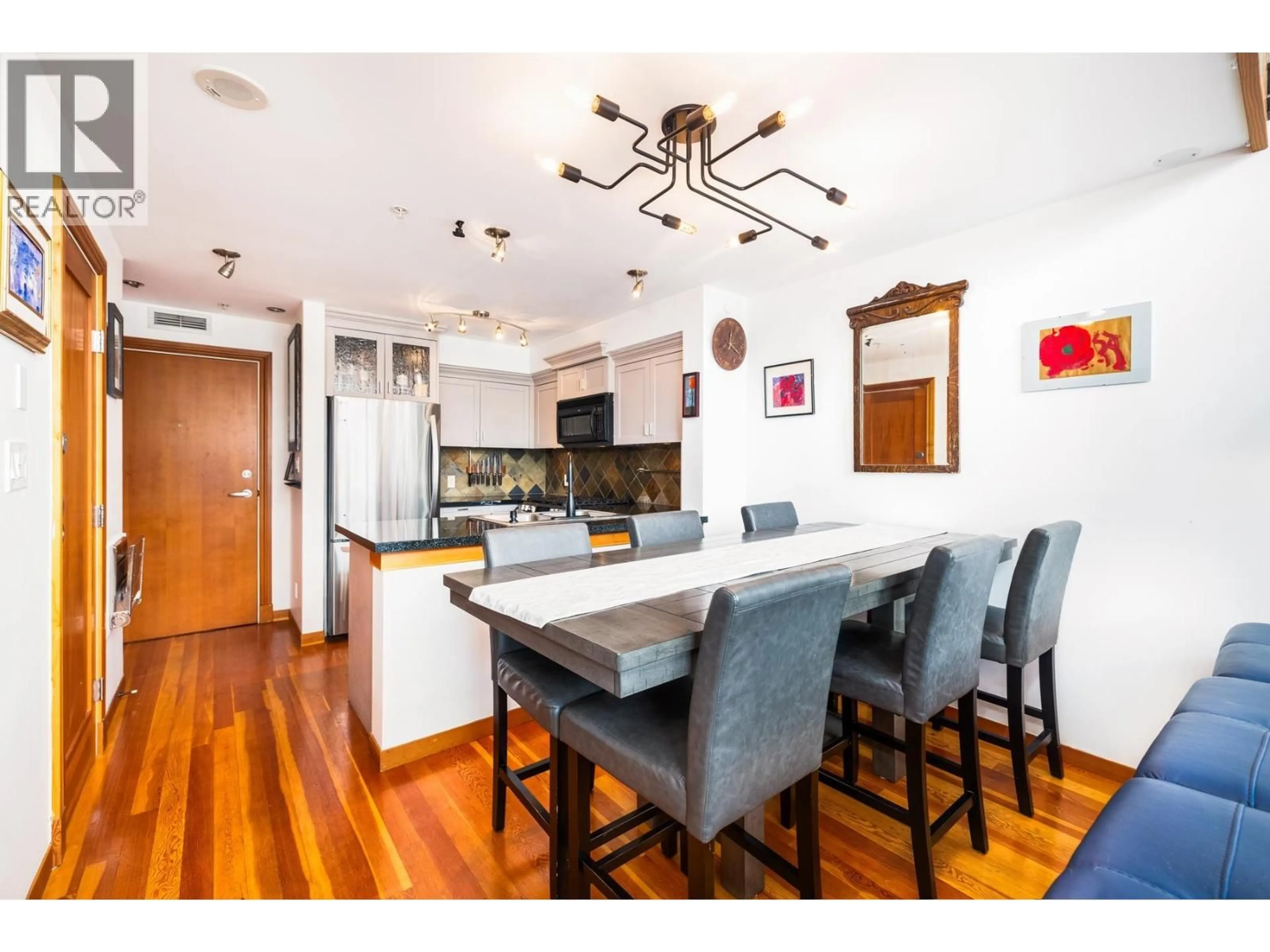 Open concept kitchen, wood/laminate floor for 519 - 10 RENAISSANCE SQUARE, New Westminster British Columbia V3M7B1