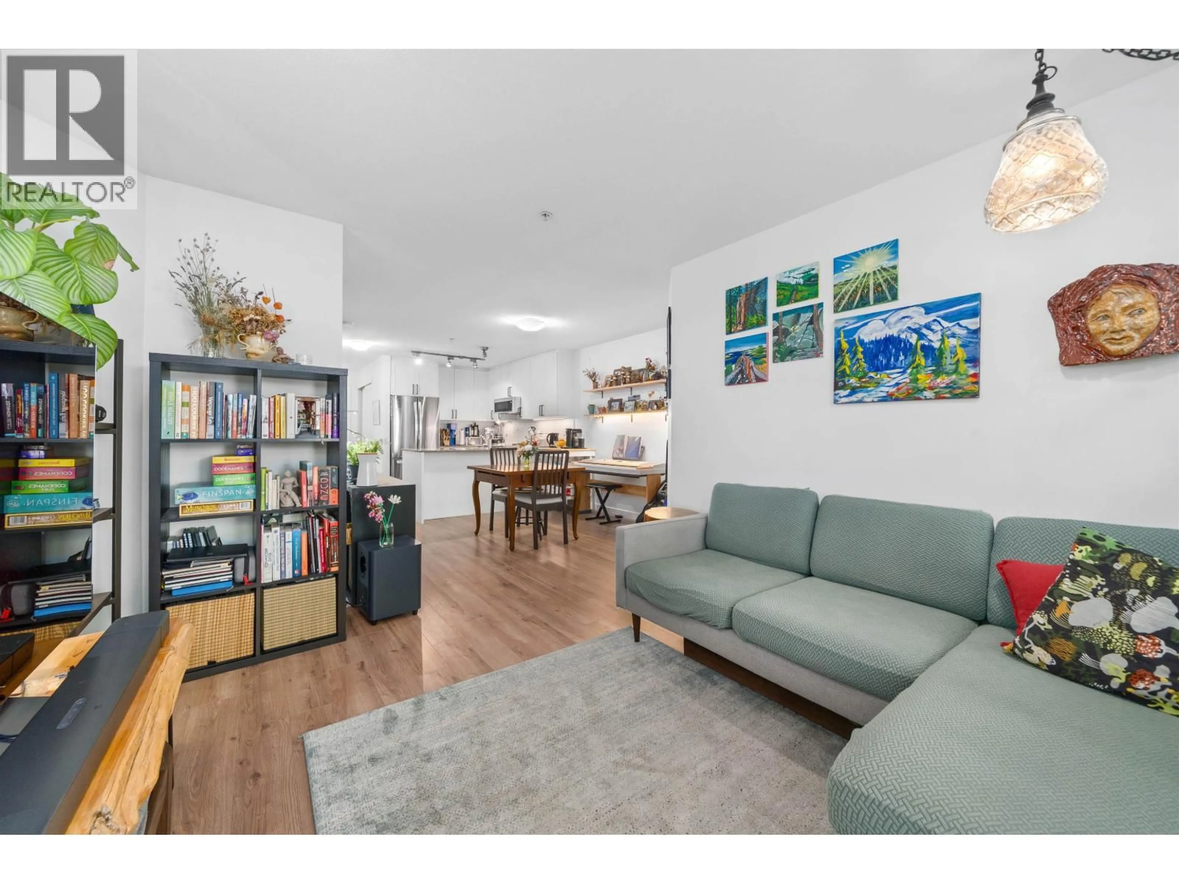 Living room with furniture, wood/laminate floor for 203 - 4833 BRENTWOOD DRIVE, Burnaby British Columbia V5C0C3