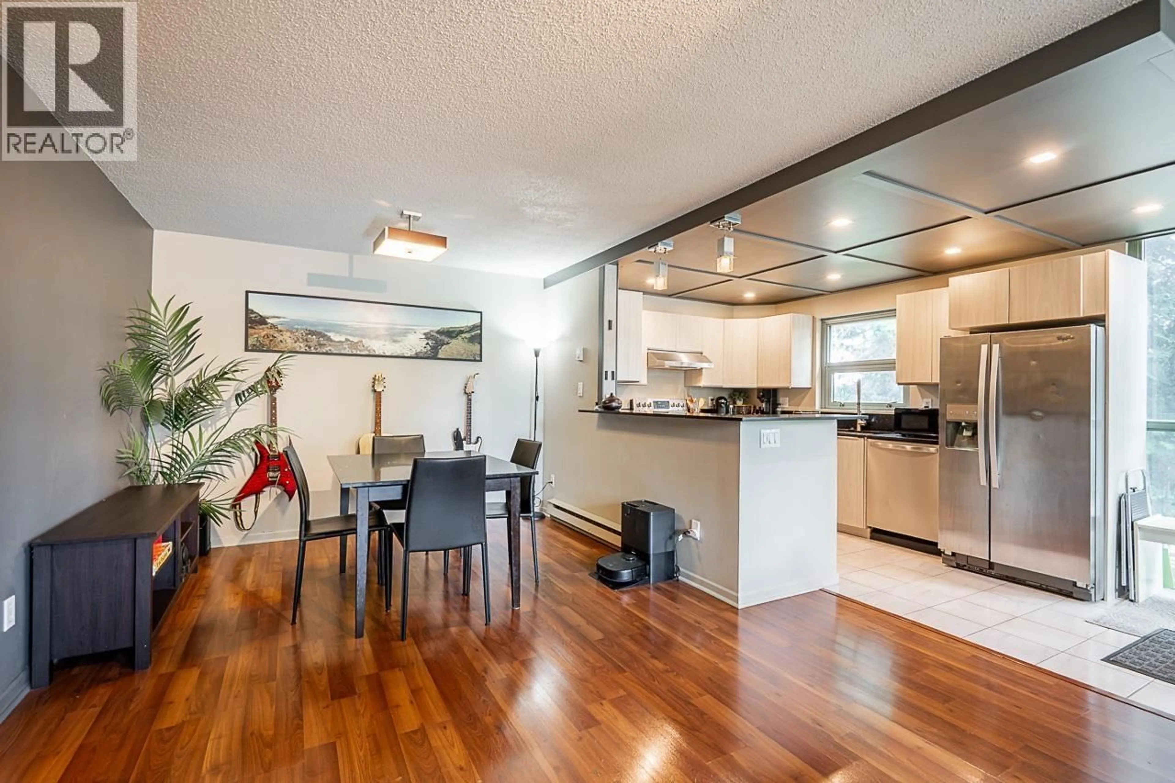 Open concept kitchen, wood/laminate floor for 220 - 7288 ACORN AVENUE AVENUE, Burnaby British Columbia V5E4H6