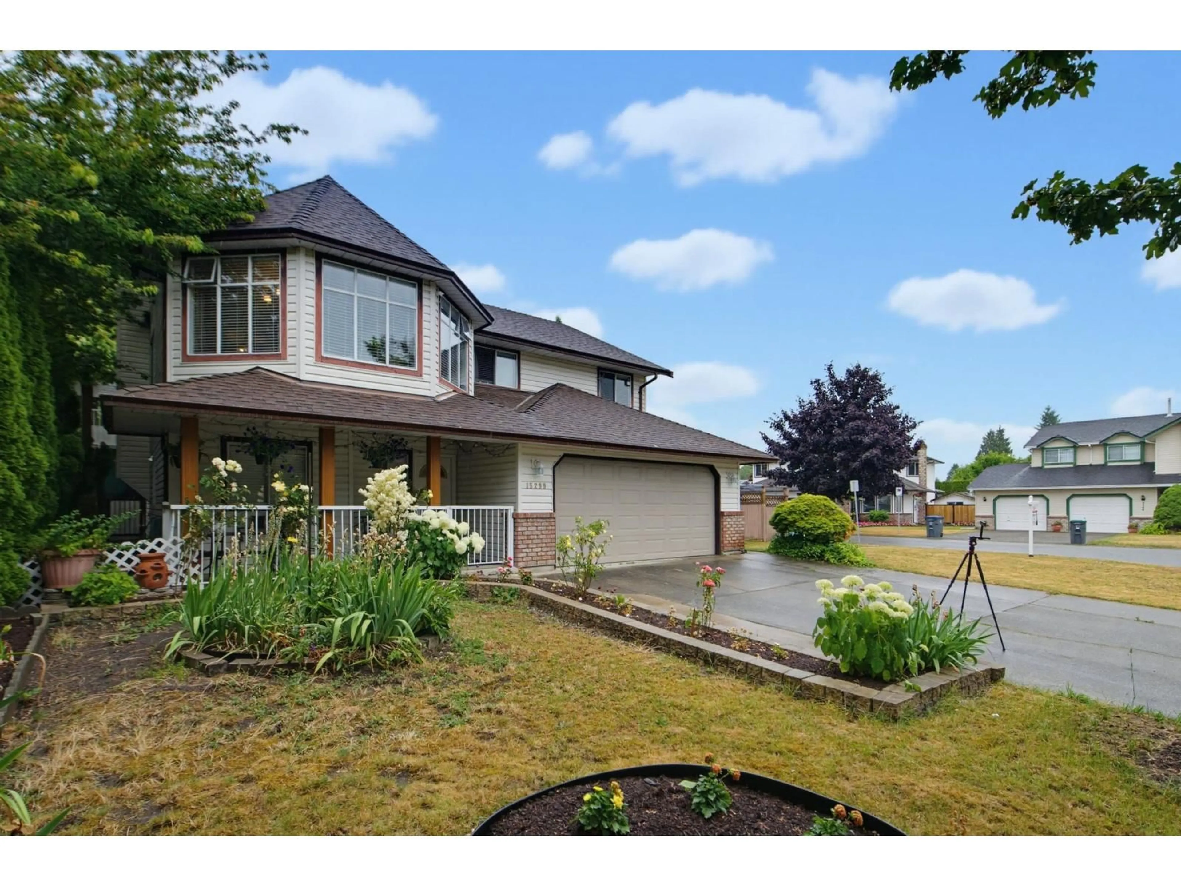 Home with vinyl exterior material, street for 15299 93A AVENUE, Surrey British Columbia V3R0E6