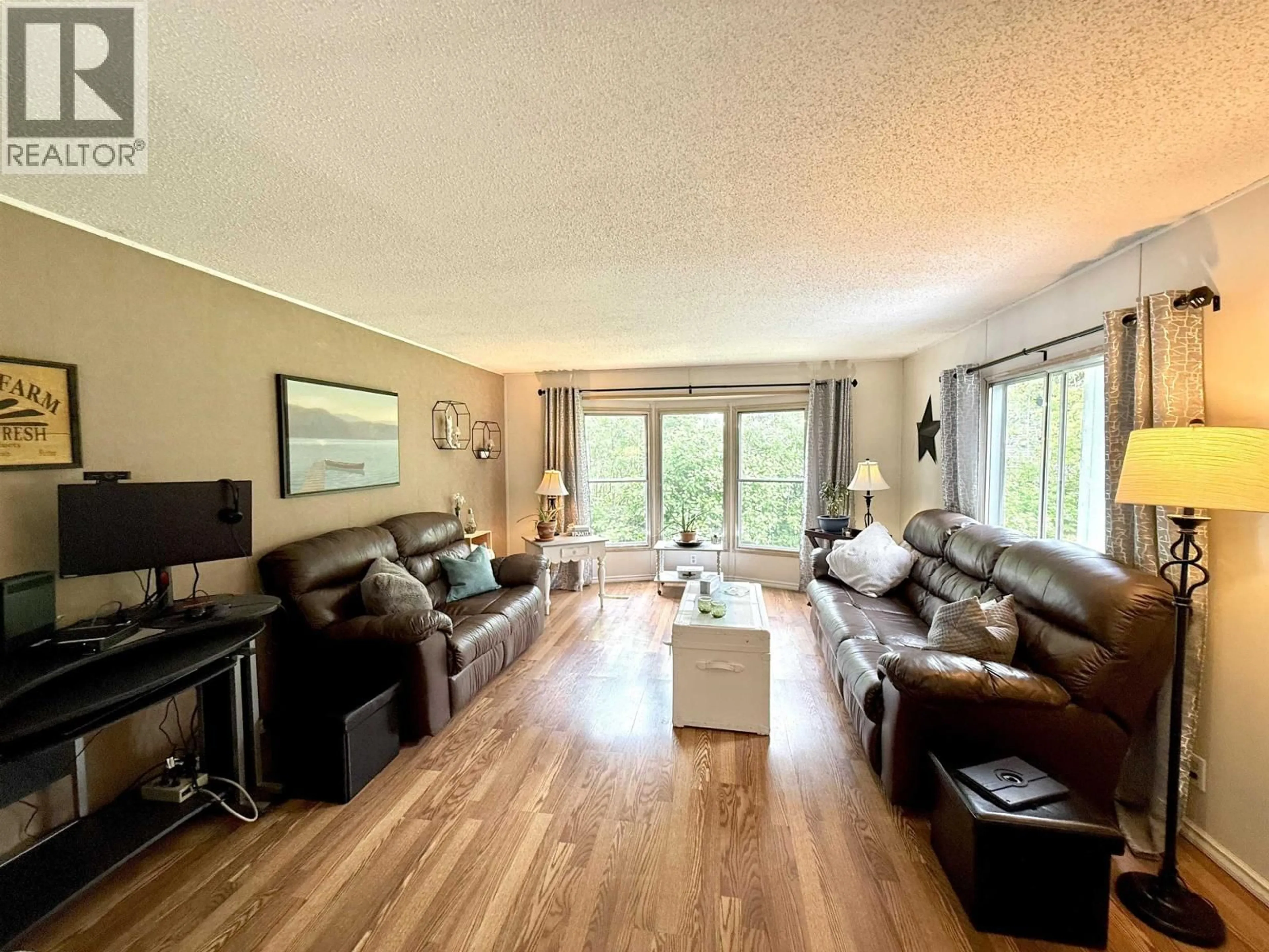 Living room with furniture, wood/laminate floor for 2136 EVASKO ROAD, Prince George British Columbia V2N6T7